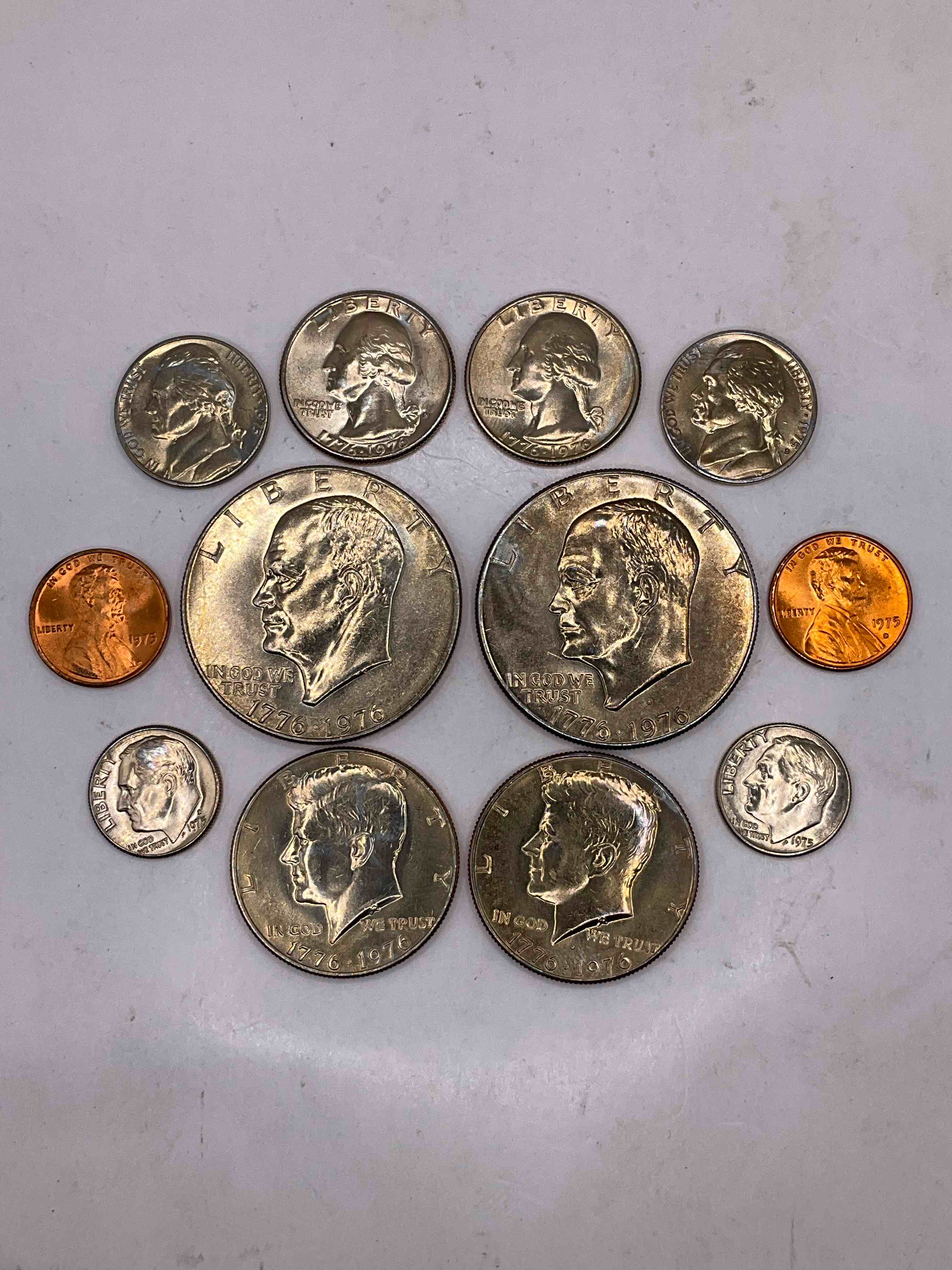 1976 Bicentennial Mint Set! This Highly Collectible Mint Set Includes 12 Coins, 6 Minted From Each Mint Location (Philly & Denver) That Year. Coins Are 1976 Special Bicentennial Edition, To Include Rare Bicentennial "Ike" Dollar! Still In Its Original Envelope Direct From The U.S. Treasury in 1976!