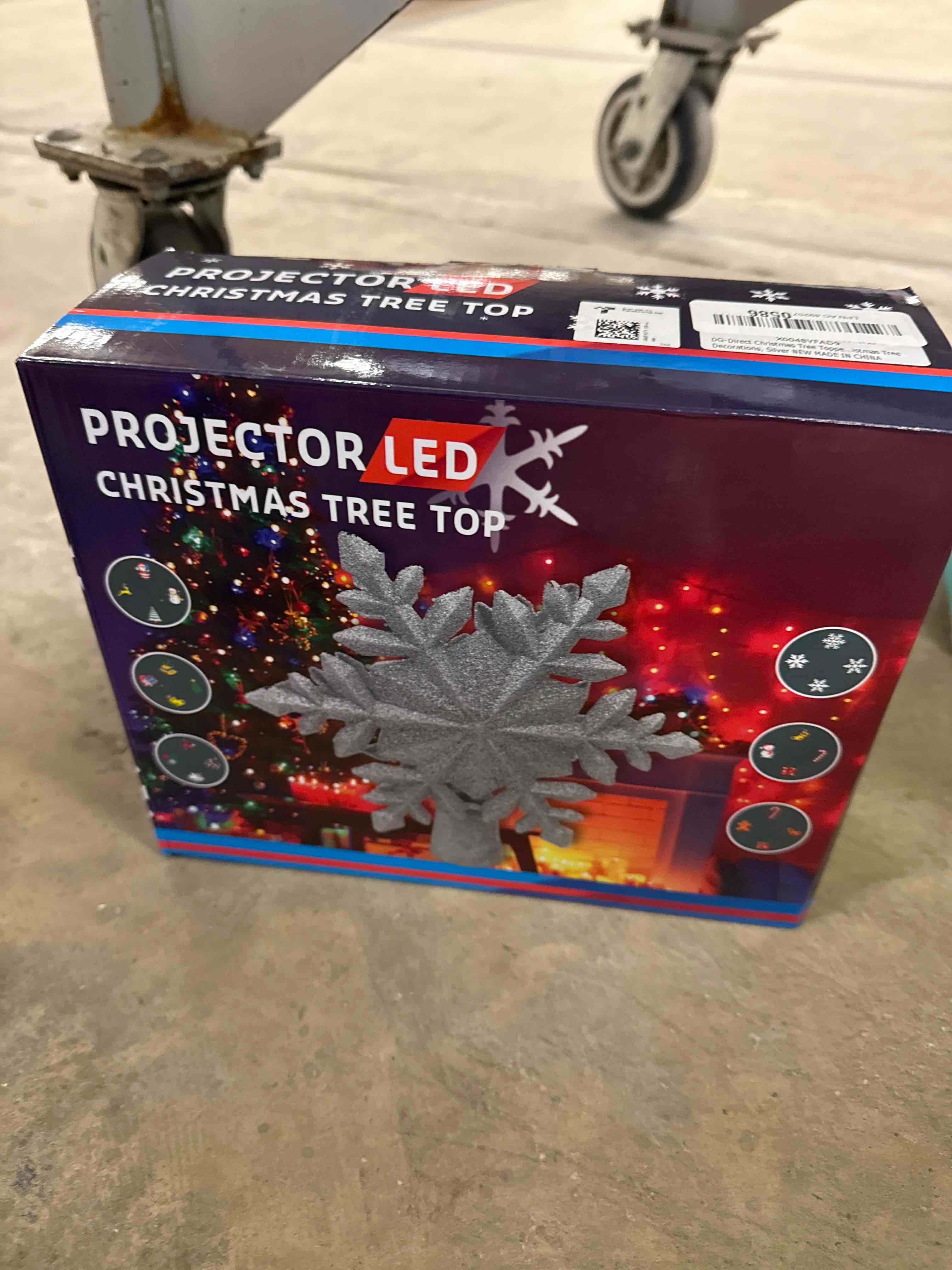 Condition photo showing Good Condition for DG-Direct Christmas Tree Topper Lighted with 6 Projected Patterns, Led Rotating Magic Snowflake, 3D Hollow Glitter Lighted Silver Snow Tree Topper for Christmas Tree Decorations, Silver Silver 6