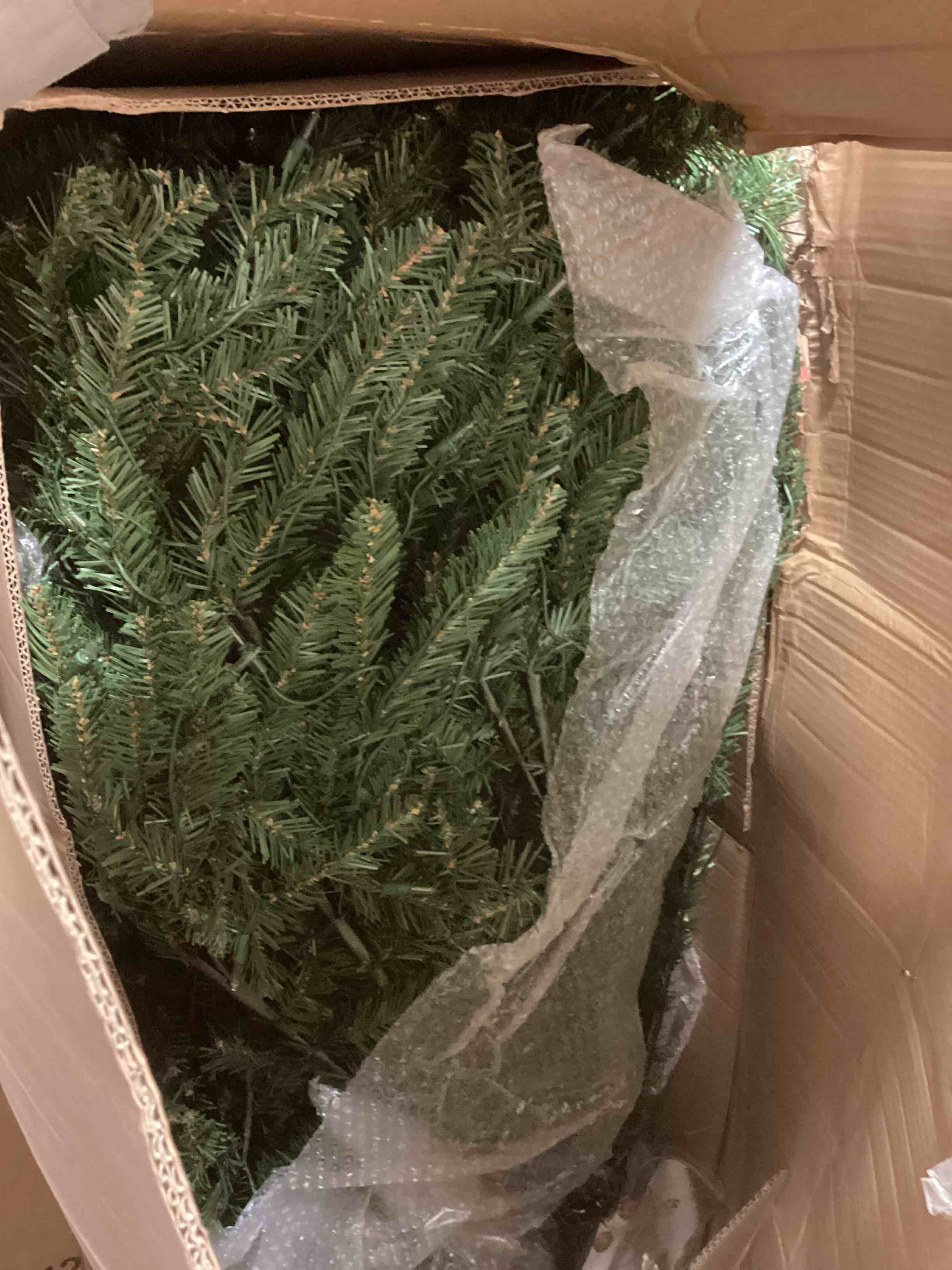 Condition photo showing As Is for Puleo International 12 Foot Pre-Lit Slim Fraser Fir Artificial Christmas Tree with 1,200 UL Listed Clear Lights, Green
