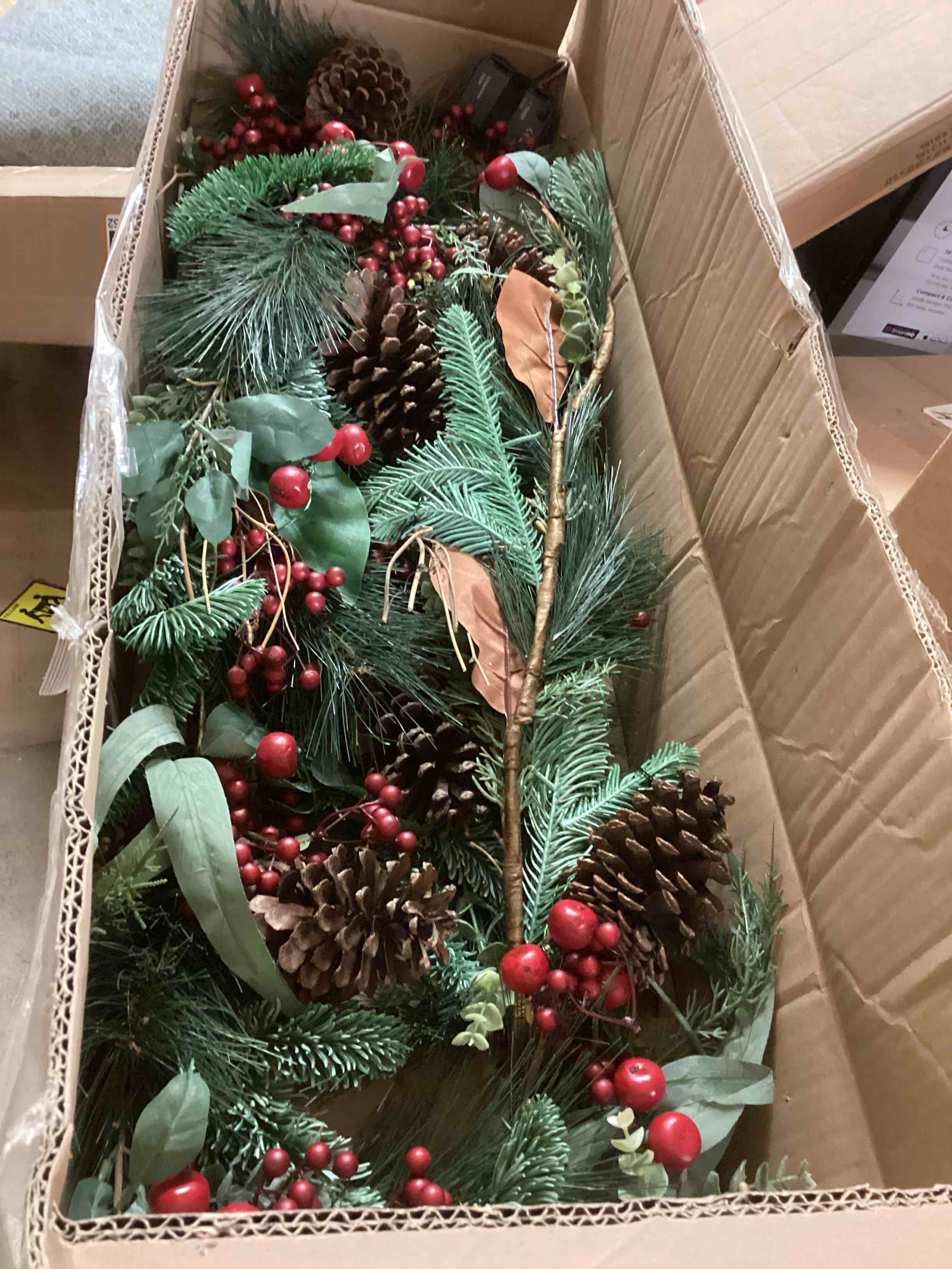 Condition photo showing Good Condition for 9 ft Magnolia Leaf  Eucalyptus  and Red Berry Garland  Pre-Lit with LED Fairy Lights  Artificial Christmas Indoor Mantel Display  Tabletop Home Décor  Battery-Operated - by Seasonal LLC