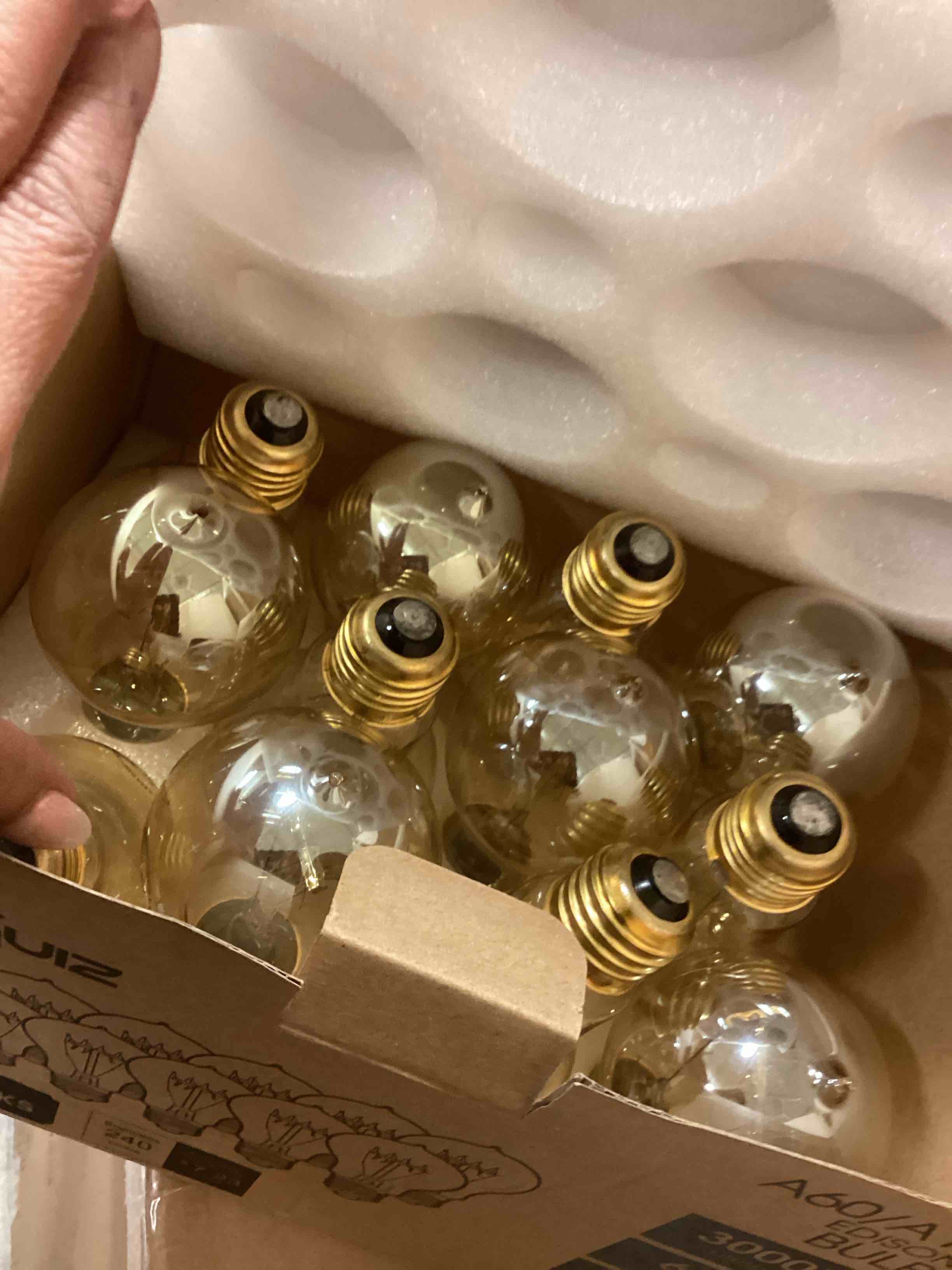 Condition photo showing Good Condition for Warm Incandescent Light Bulbs 60 Watt,A19/A60 Vintage Style Edison Bulbs E26,Soft Yellow Light Bulbs,Amber Bulbs,Retro Light Bulb Old Fashioned,Halogen Dimmable Edison Bulb Squirrel Cage 12 Pack Amber Glass-2100k 12 Count (Pack of 1)