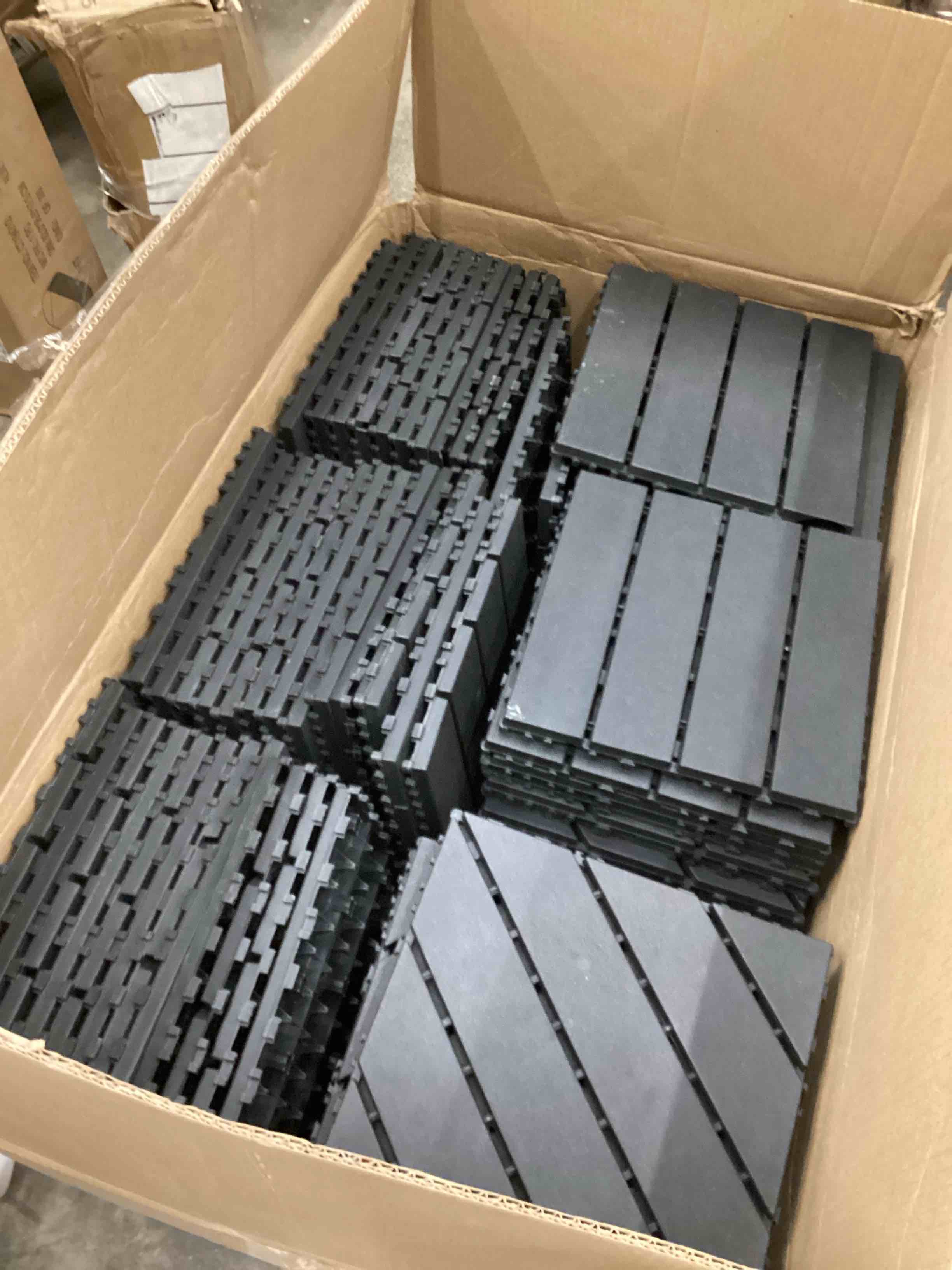 Condition photo showing As Is for Assorted of Interlocking Desk Tiles 12”x12” Dark Grey (85 tiles) (2 different styles ) 