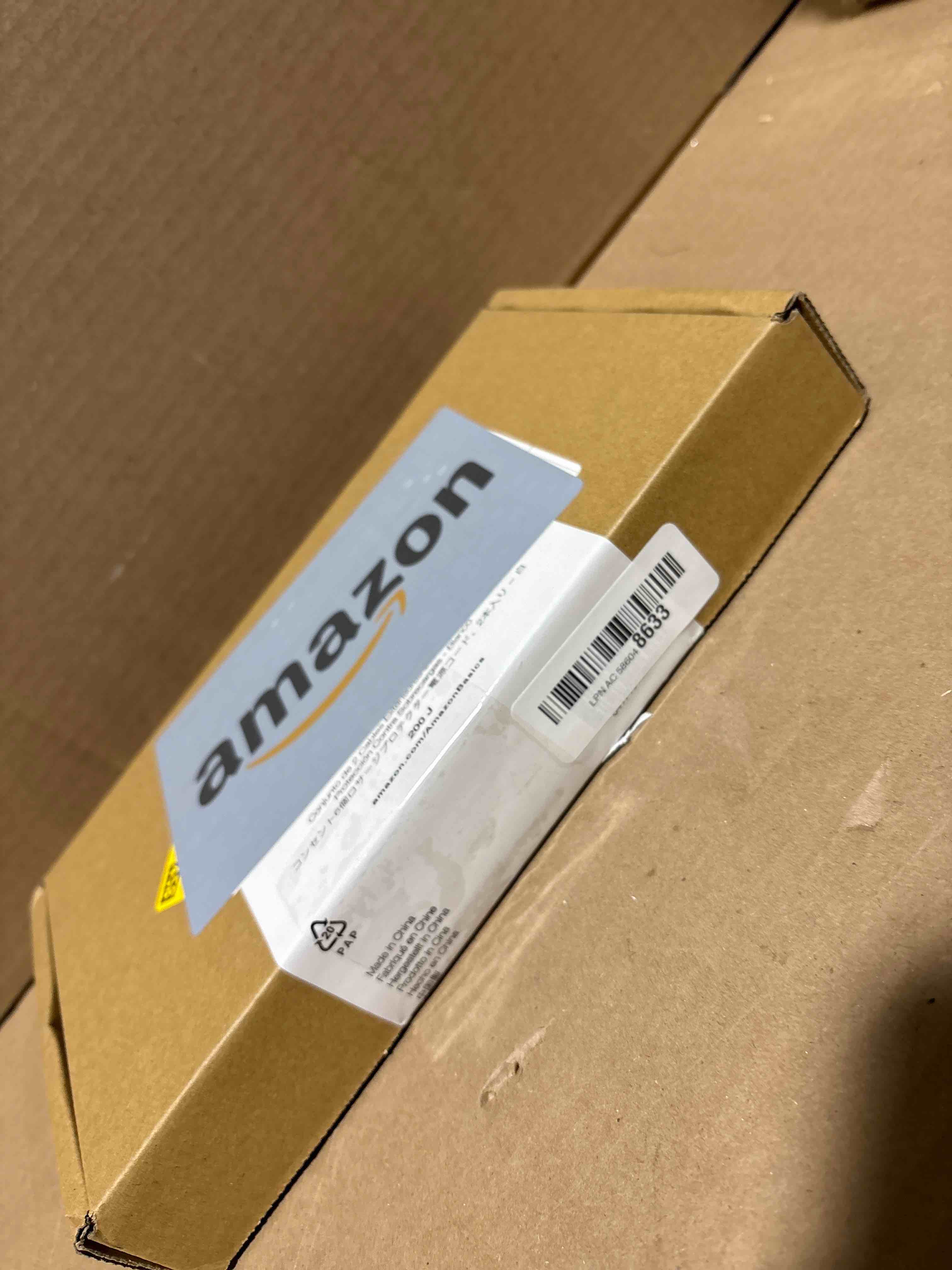 Condition photo showing New/Like New for Amazon Basics Surge Protector Power Strip, 6-Outlet with 200J Protection, 2ft Extension Cord, Rectangle, White 200 Joule White 