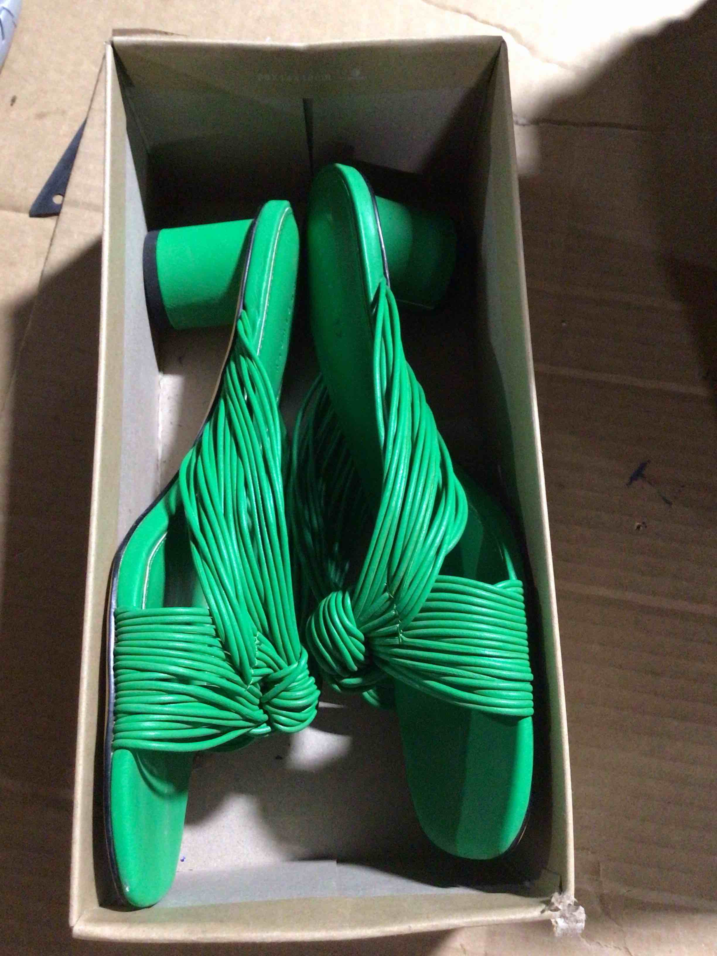 Block heel sandals with knotted straps,identified as the maven knot sandal model of the sanctuary brand 