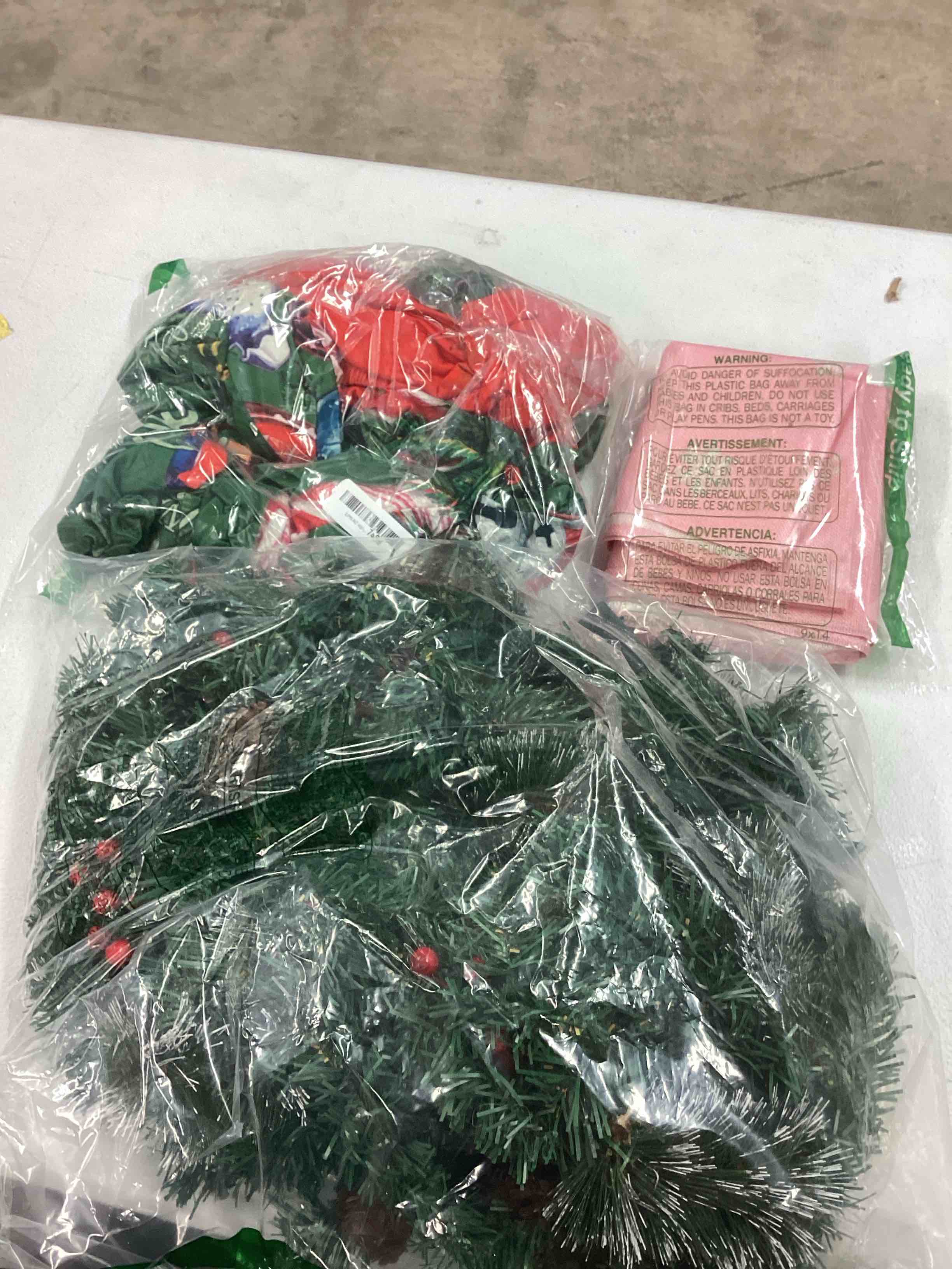 assorted Christmas items (garland, chair covers and tree collar )