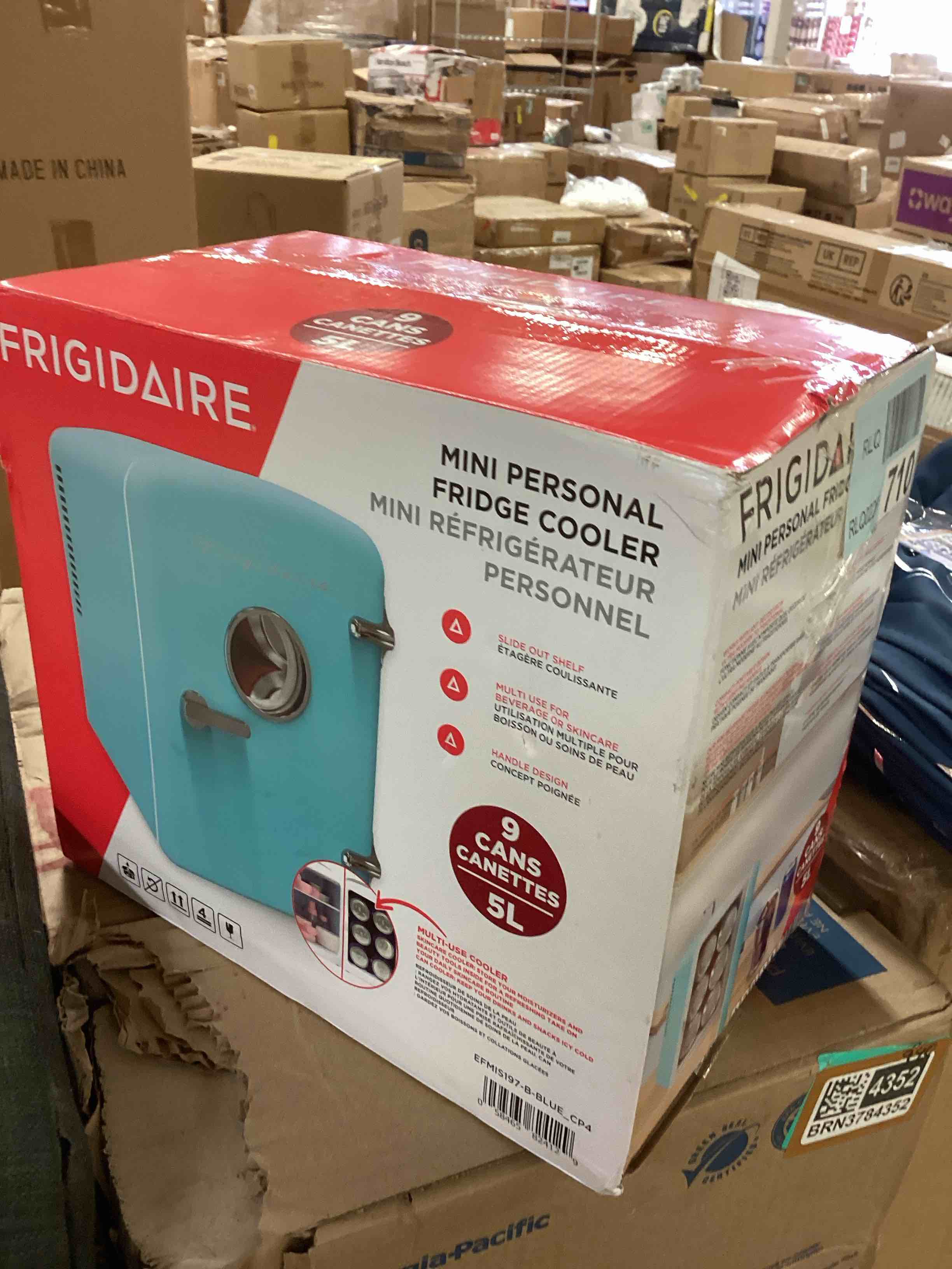 Condition photo showing New/Like New for frigidaire retro 9-can mini personal fridge portable cooler for car, office, bedroom, dorm room, or cabin, 11.8" d x 7.1" w x 10.1" h, blue