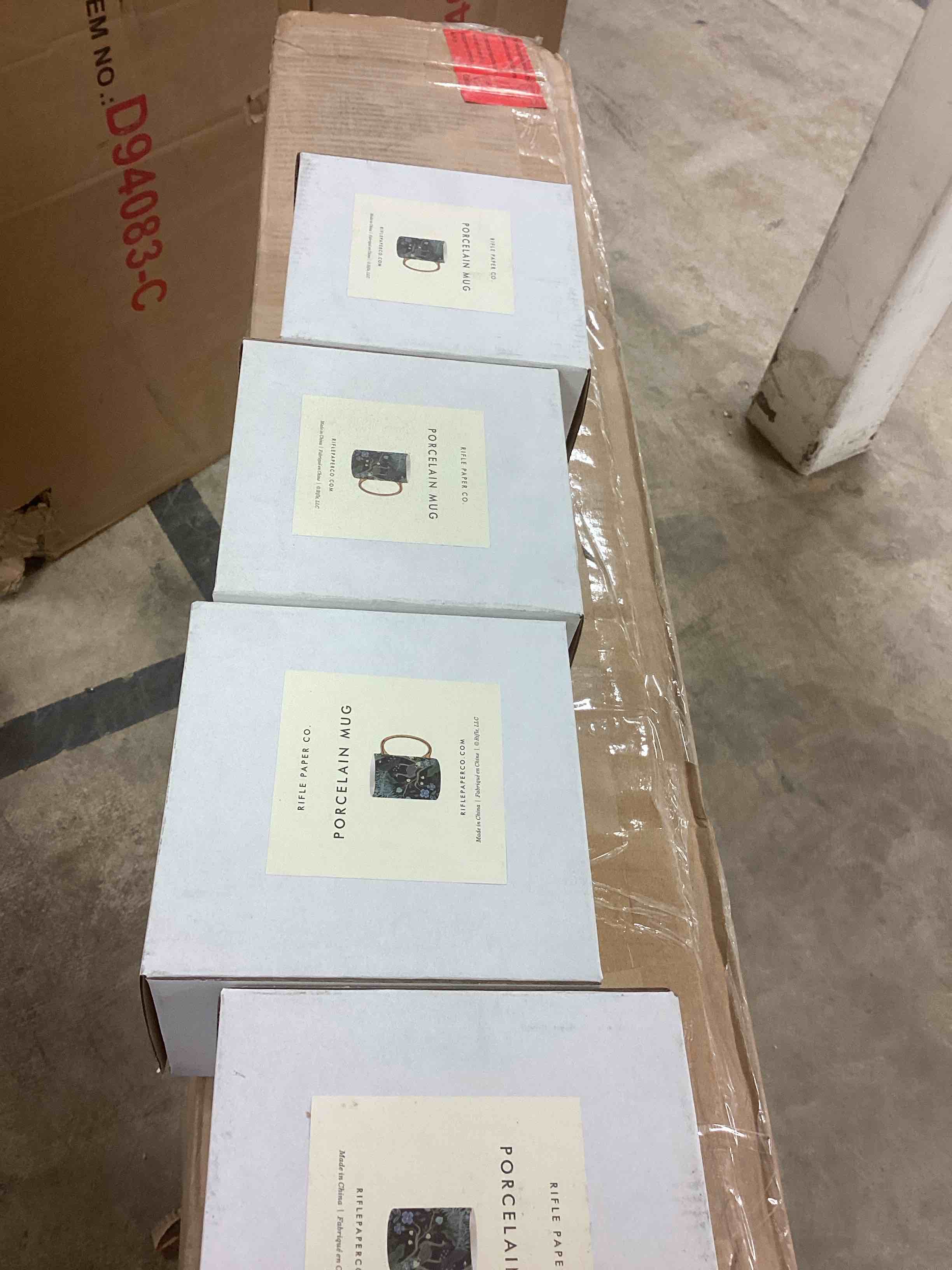 Condition photo showing New/Like New for rifle paper co. peacock porcelain mug - porcelain 16 oz mug, full-color illustration with metallic gold accents, 4.5" l x 3.125" w, deep midnight blue with gilded rim and handle