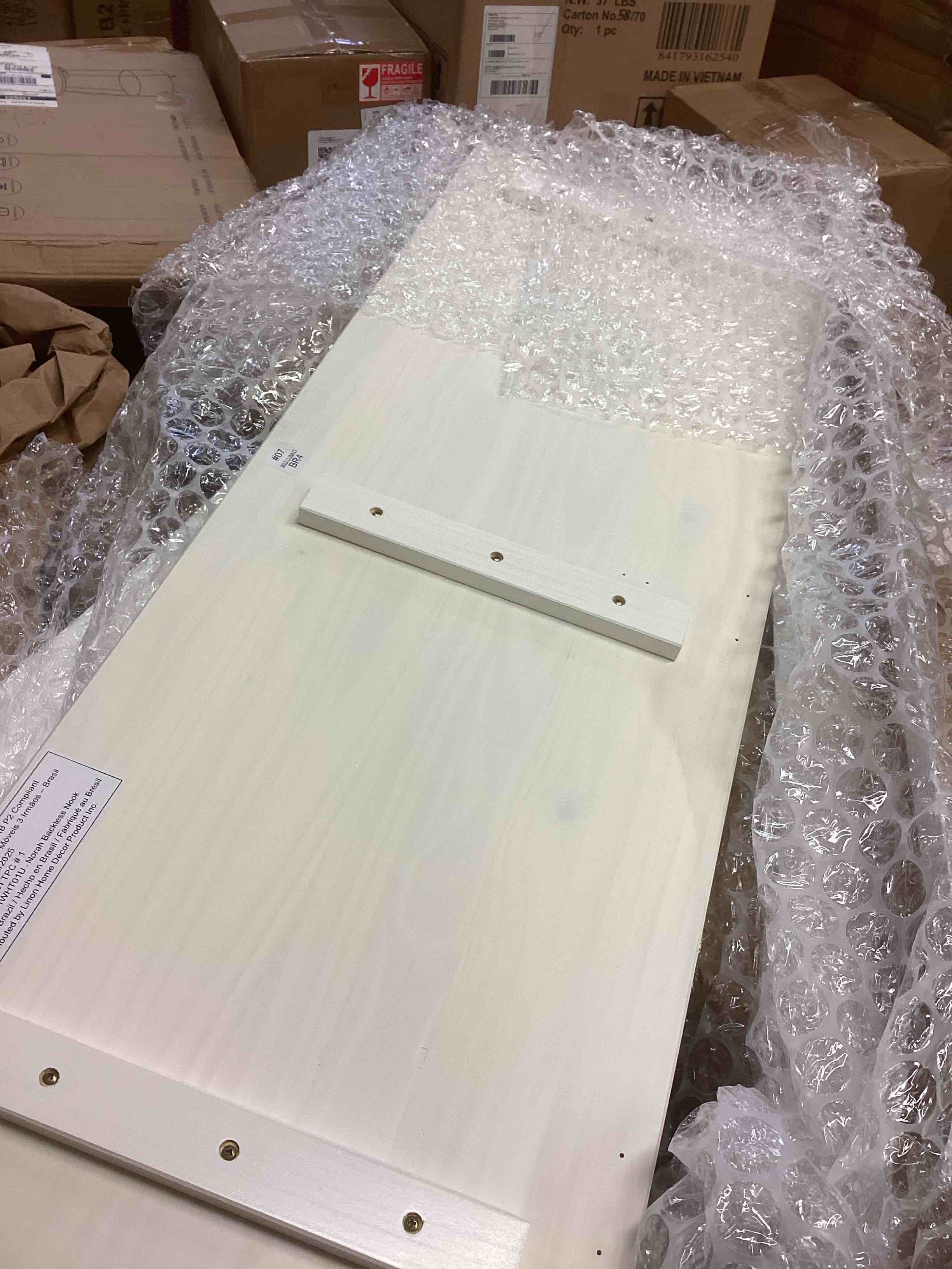 Condition photo showing As Is for linon josie l-shaped backless breakfast nook bench (incomplete one box only)