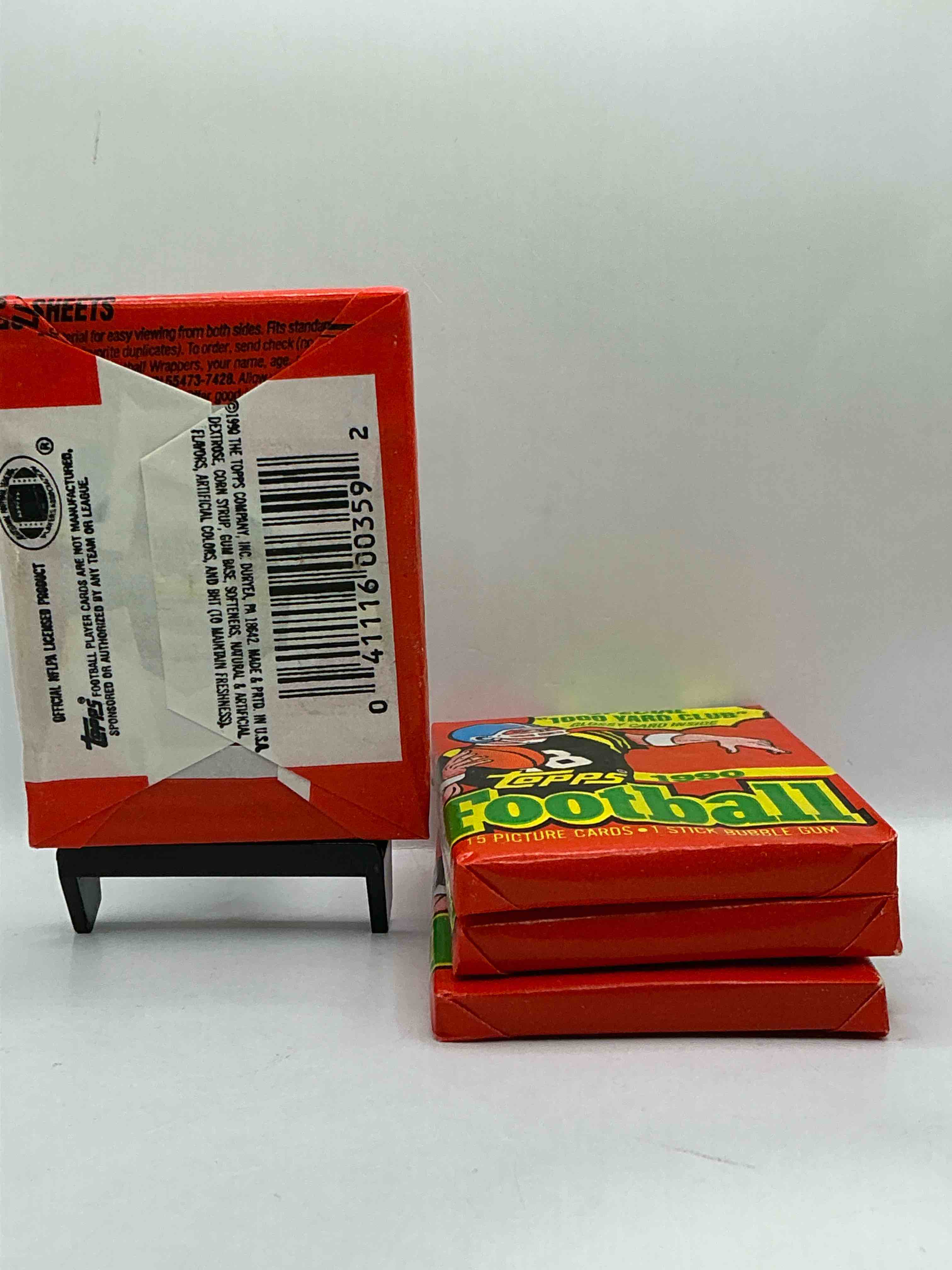 Condition photo showing New/Like New for The Last Year Of Football Wax! Joe Montana, Emmitt Smith & Barry Sanders!? 1990 Topps Football Unopened Sports Card Wax Pack, Direct From Original Retail Box! Getting Hard To Find! Search For Early Barry Sanders & Jerry Rice & So Much More!