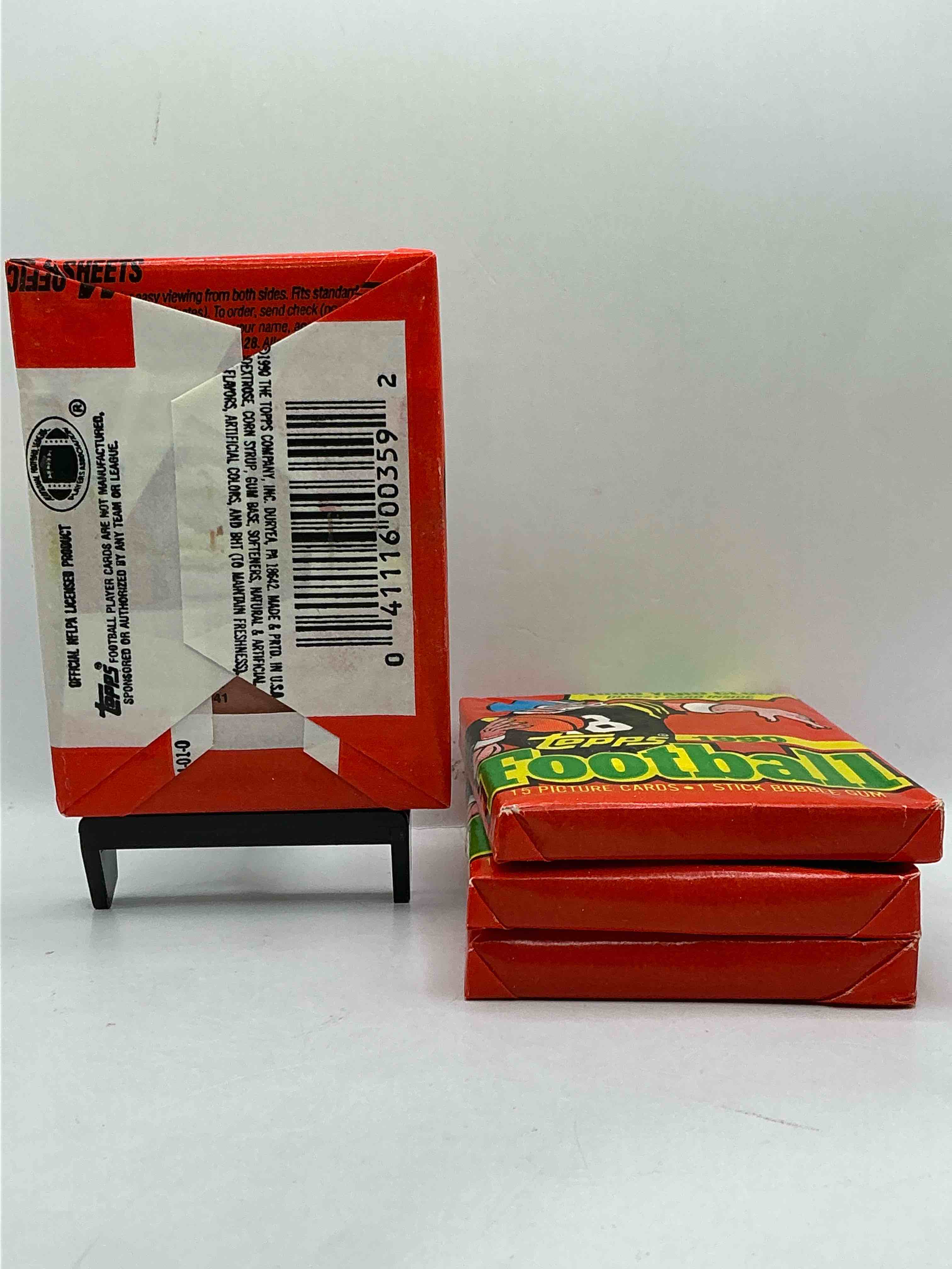 Condition photo showing New/Like New for The Last Year Of Football Wax! Joe Montana, Emmitt Smith & Barry Sanders!? 1990 Topps Football Unopened Sports Card Wax Pack, Direct From Original Retail Box! Getting Hard To Find! Search For Early Barry Sanders & Jerry Rice & So Much More!