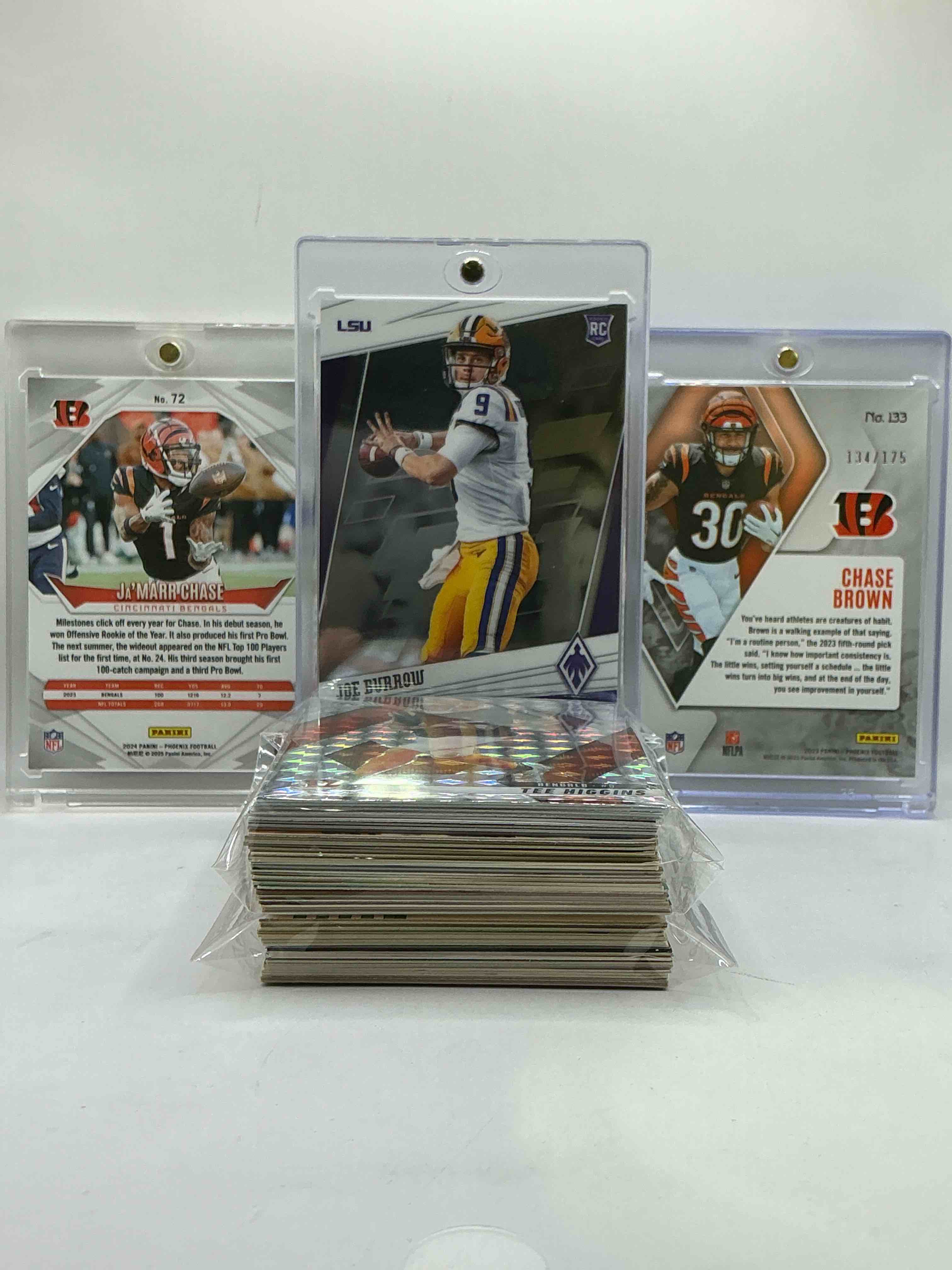 Condition photo showing New/Like New for Bengals Bonanza! Phoenix Trio Match! Ultra Rare Ja’marr Chase Phoenix Black Edition Card, Joe Burrow Phoenix Rookie, Chase Brown Phoenix Rookie /175 & More! This 50 Card Lot Includes Commons, Legends, Rookies & More! Vintage & New! 50 Card Bengals Lot, Bengals Lovers Rejoice!