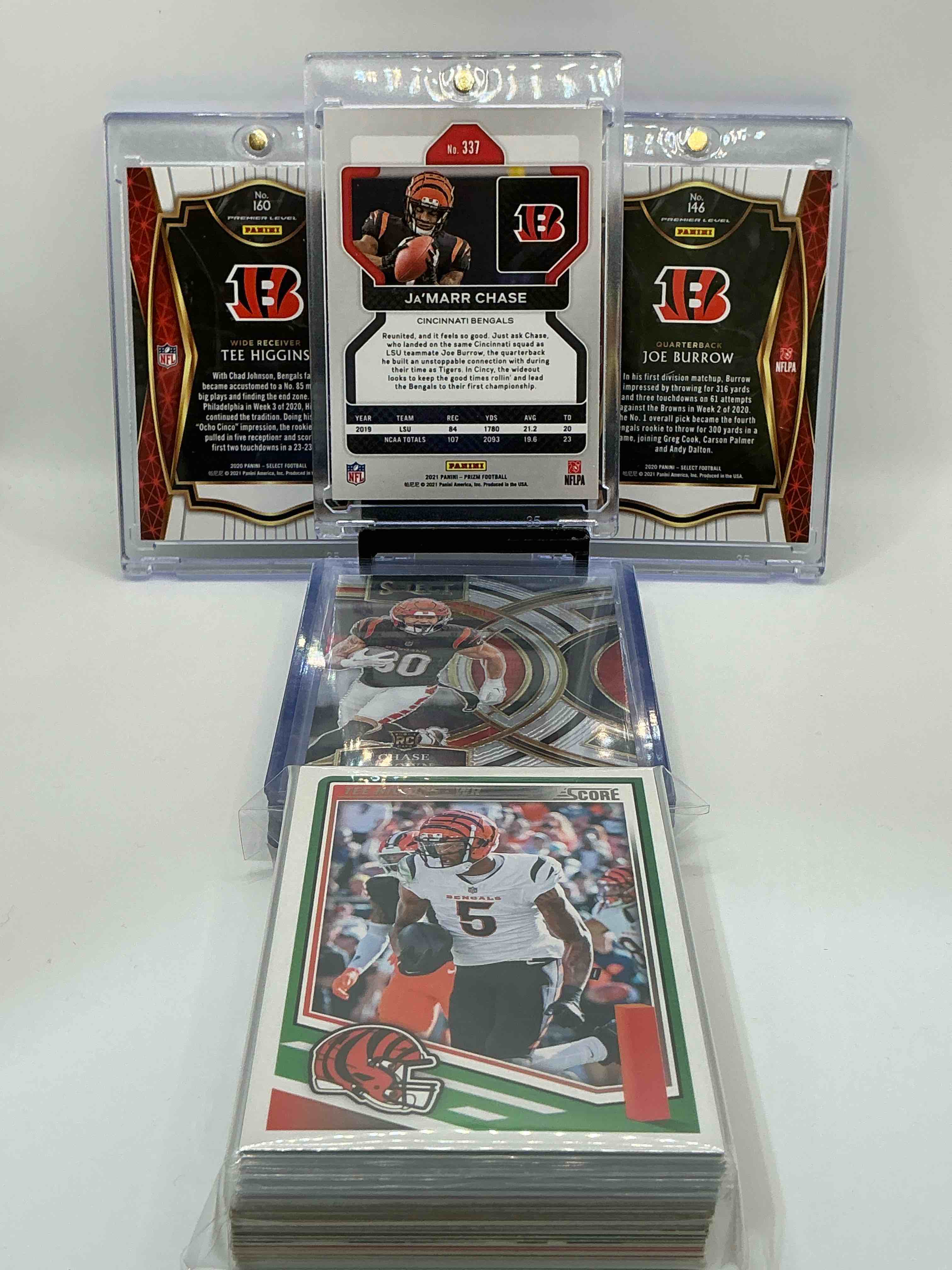 Condition photo showing New/Like New for Bengals Bonanza! 2021 Prizm Rookie Ja’marr Chase! 2020 Select Rookie Tee Higgins! 2020 Rookie Joe Burrow! Along With 50 Other Bengals Heroes, Legends, Rookies & Commons!