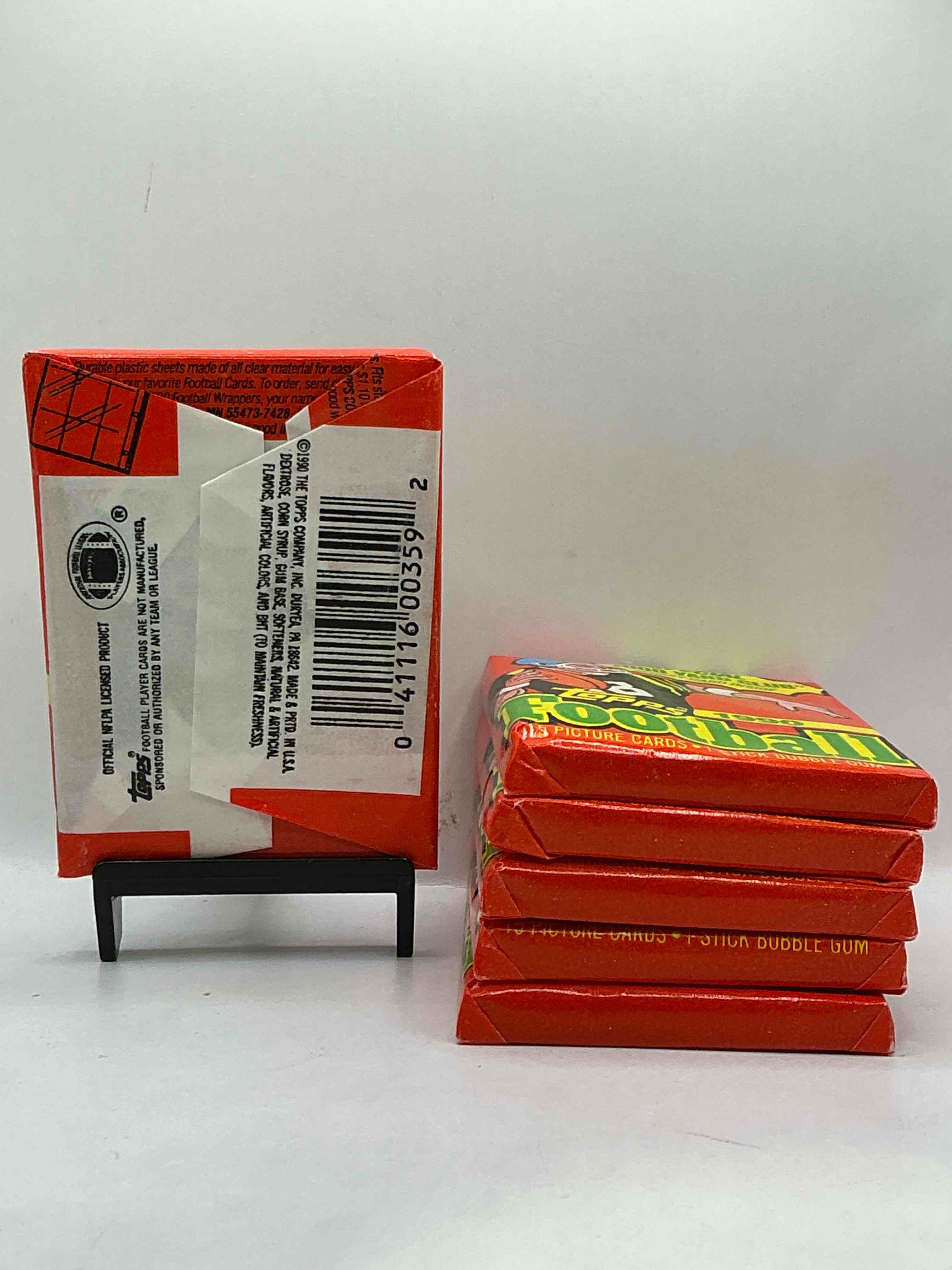 Condition photo showing New/Like New for The Last Year Of Football Wax! Joe Montana, Emmitt Smith & Barry Sanders!? 1990 Topps Football Unopened Sports Card Wax Pack, Direct From Original Retail Box! Getting Hard To Find! Search For Early Barry Sanders & Jerry Rice & So Much More!