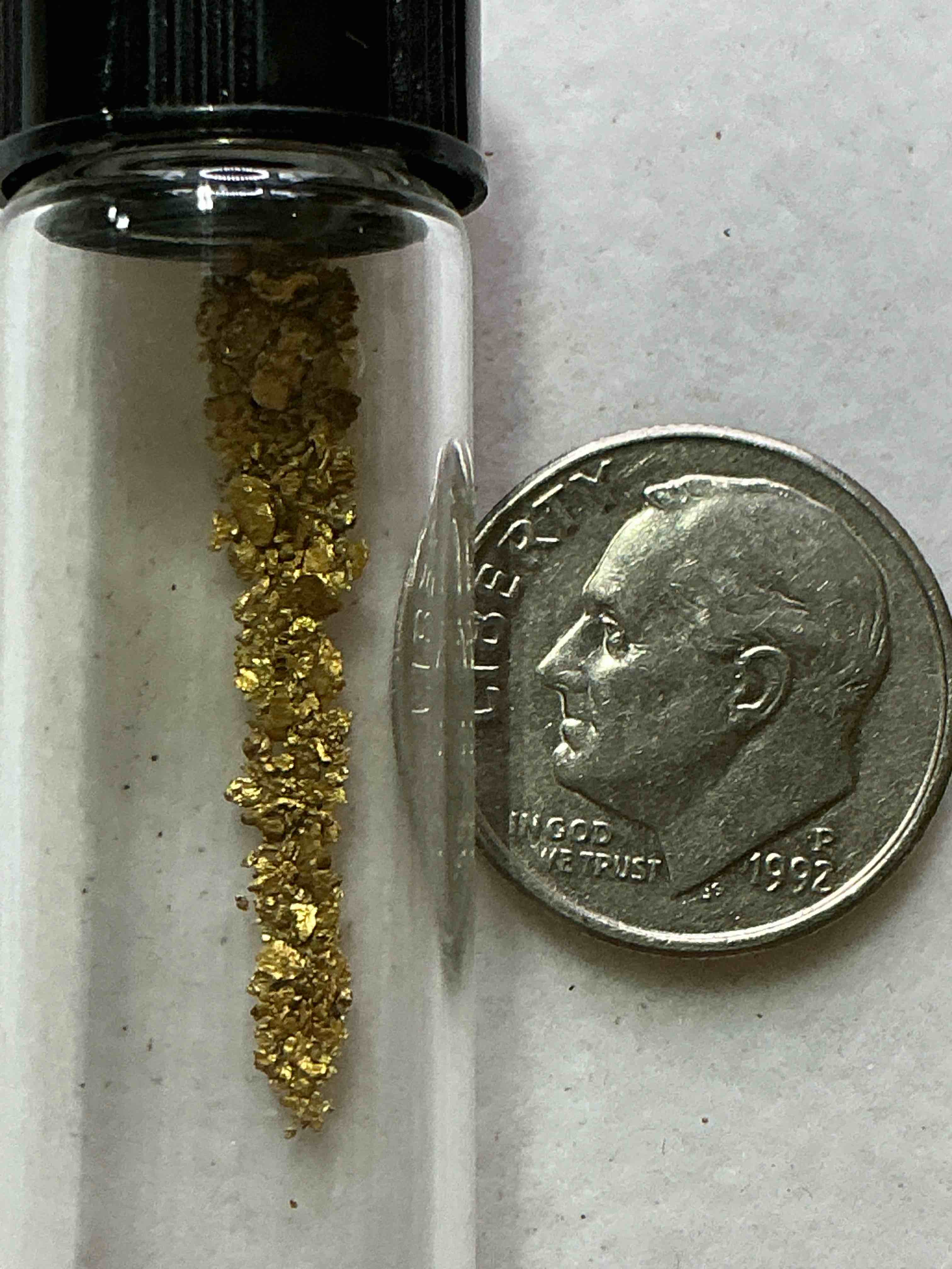 Condition photo showing New/Like New for Genuine Gold Nuggets! Gold Nuggets Fresh From Prospecting North Carolina Mountains, Total Weight Of All Nuggets Is Approximately .5 Grams. These Gold Nuggets Typically Test At Between Approx 22-24 Karat. Gold In Raw, Prospected Form Is Extremely Hard To Find & Much Rarer Than Any Refined Form. Get In On The Gold Craze... Gold Has Increased In Value Over 40% Since 2025! U.S. Dime For Size Reference Only (not included). Gold Vile In Image Included. Own Genuine, Gold Nuggets!