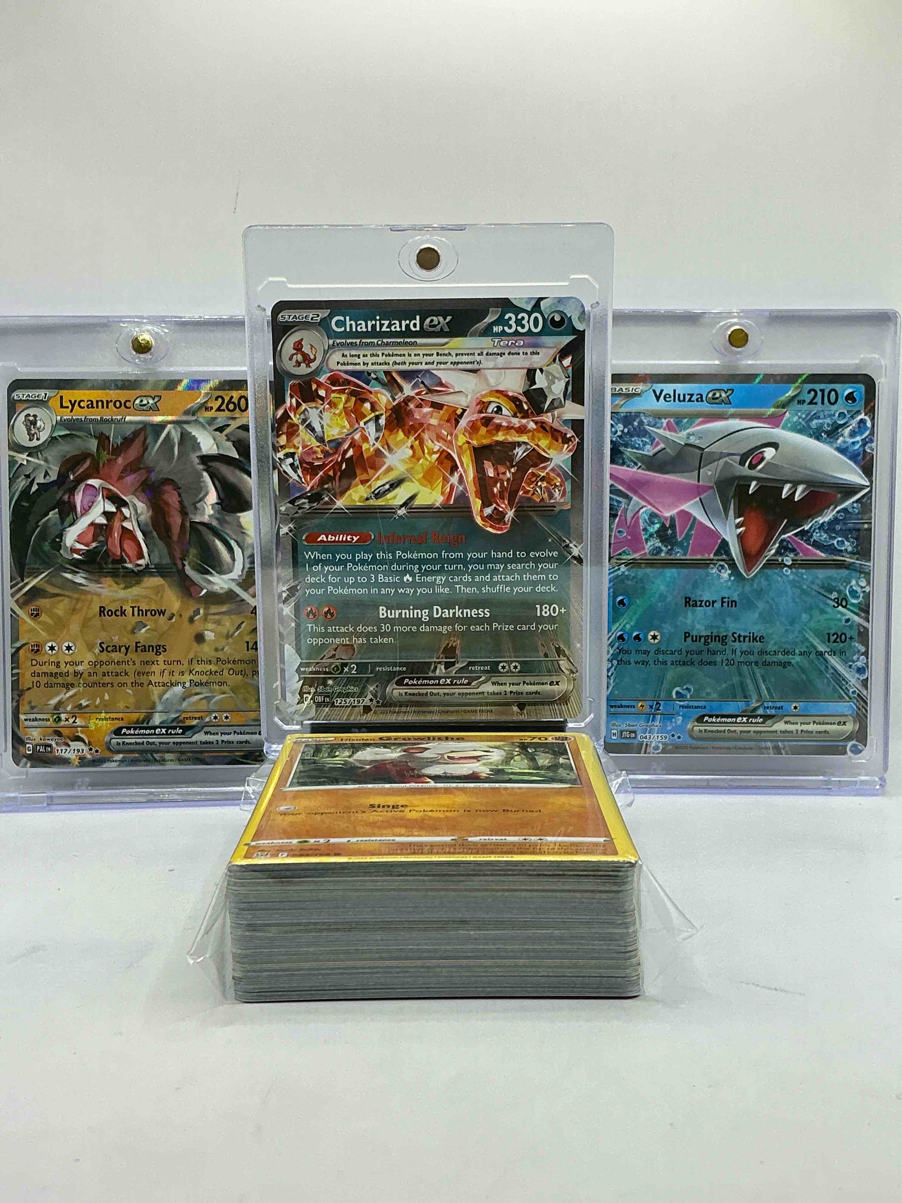 pokémon palooza! charizard ex holo, lycanroc ex & velez’s ex! pokémon insanity! this 50 card lot includes commons, legends, heroes, holos & more! pokémon party! join the craze! some of the most popular monsters included!