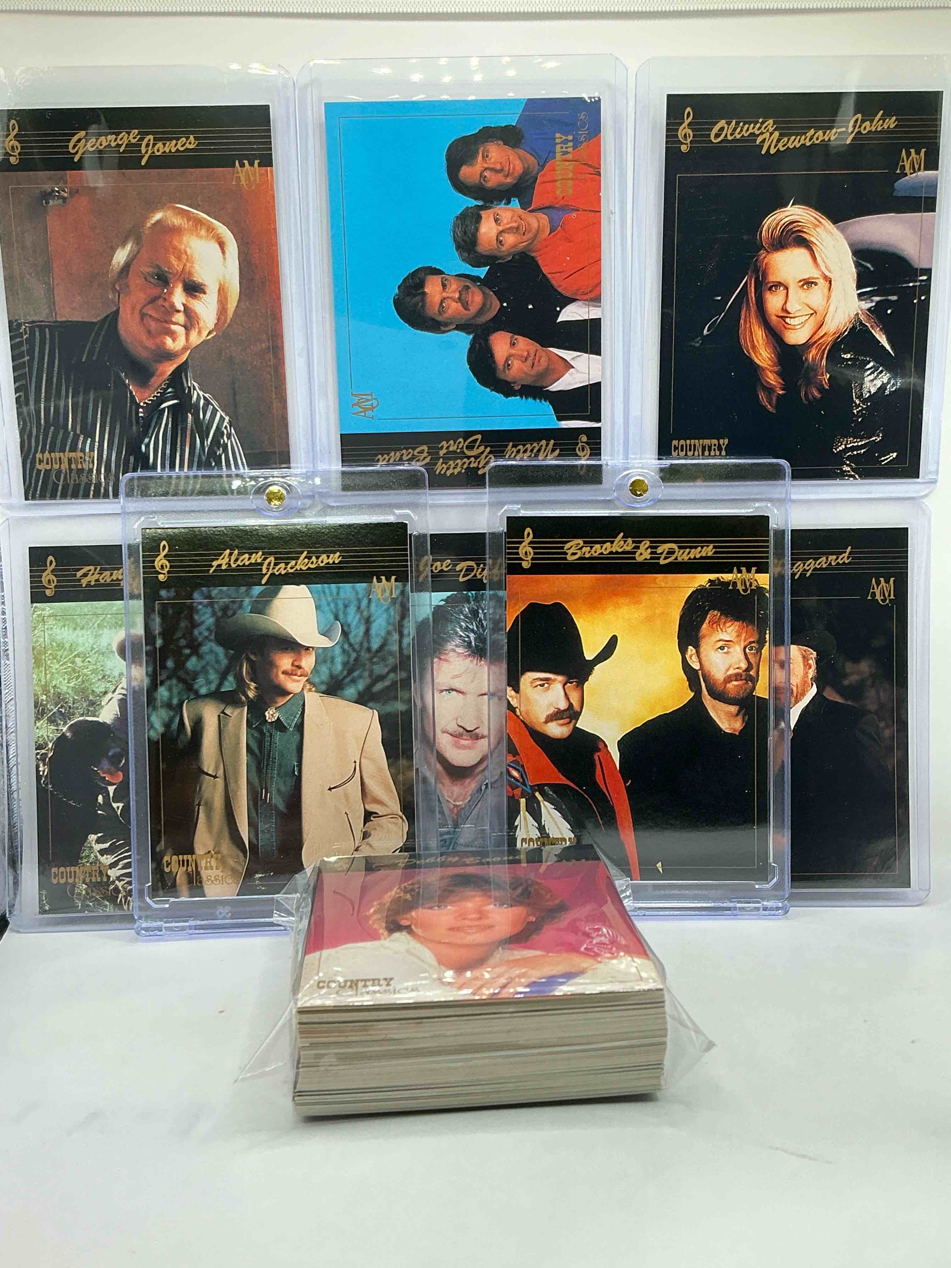 hank williams jr! alan jackson! no way! country music craziness! olivia newton john, george jones, nitty gritty, joe diffe & more! insane 50 card country music lot! 1992 cards, some of the biggest names in the country world! perfect for vintage, authentic & real country fans! 