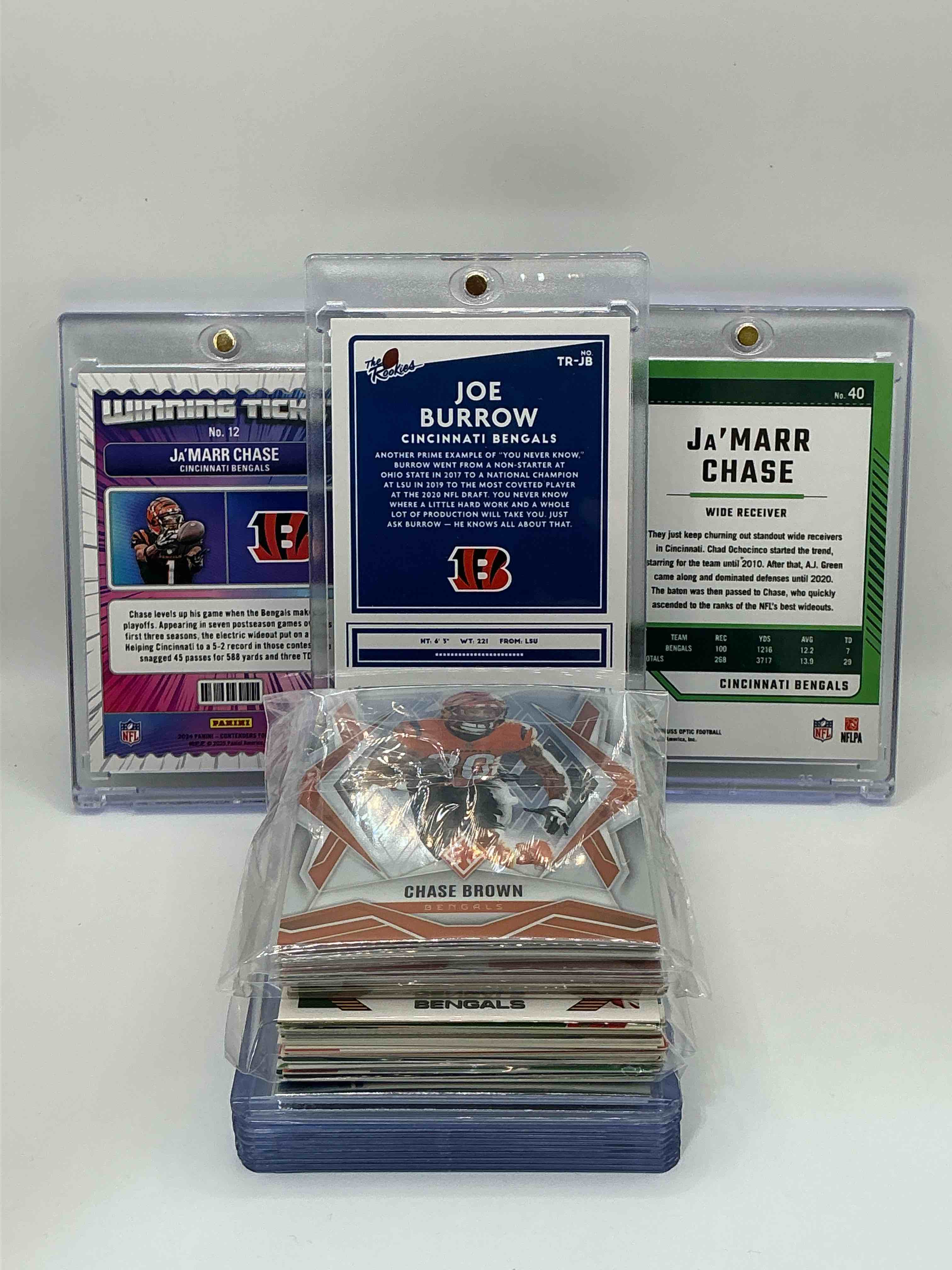 Condition photo showing New/Like New for Bengals Bonanza! 2020 Donruss “The Rookies” Silver Rookie Joe Burrow! 2024 Panini Contenders “Winning Ticket” Ja’marr Chase! 2024 Donruss Optic Shimmer Ja’marr Chase! Along With 50 Other Bengals Heroes, Legends, Rookies & Commons!