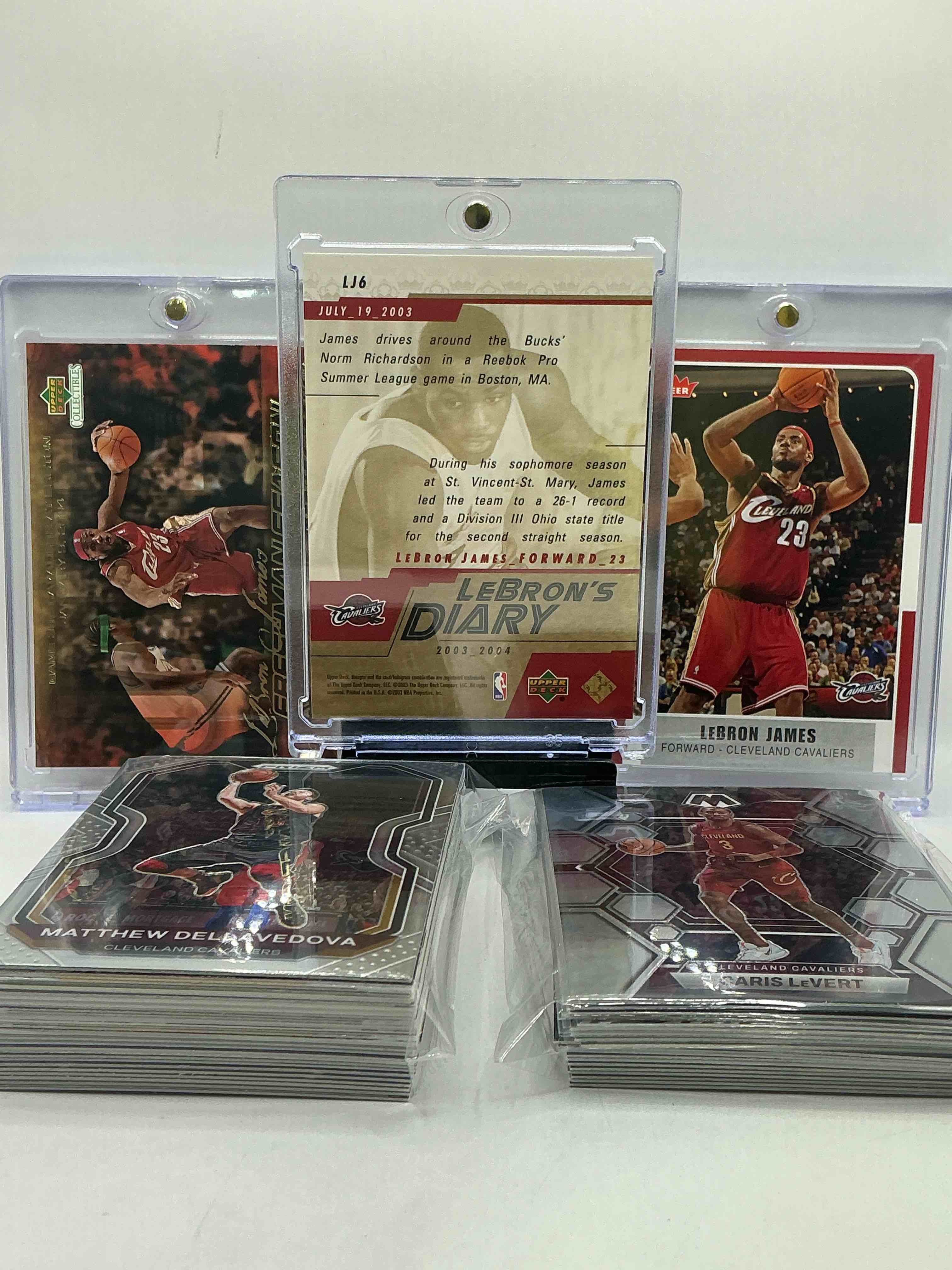 Condition photo showing New/Like New for LeBron’s Diary First Year Card Upper Deck, Fleer LeBron James Card, Upper Deck Freshman Season Upper Deck Rookie & More! Insane Trio! Cavs Craziness! Mostly Modern Cavaliers 50 Card Lot! Insane!