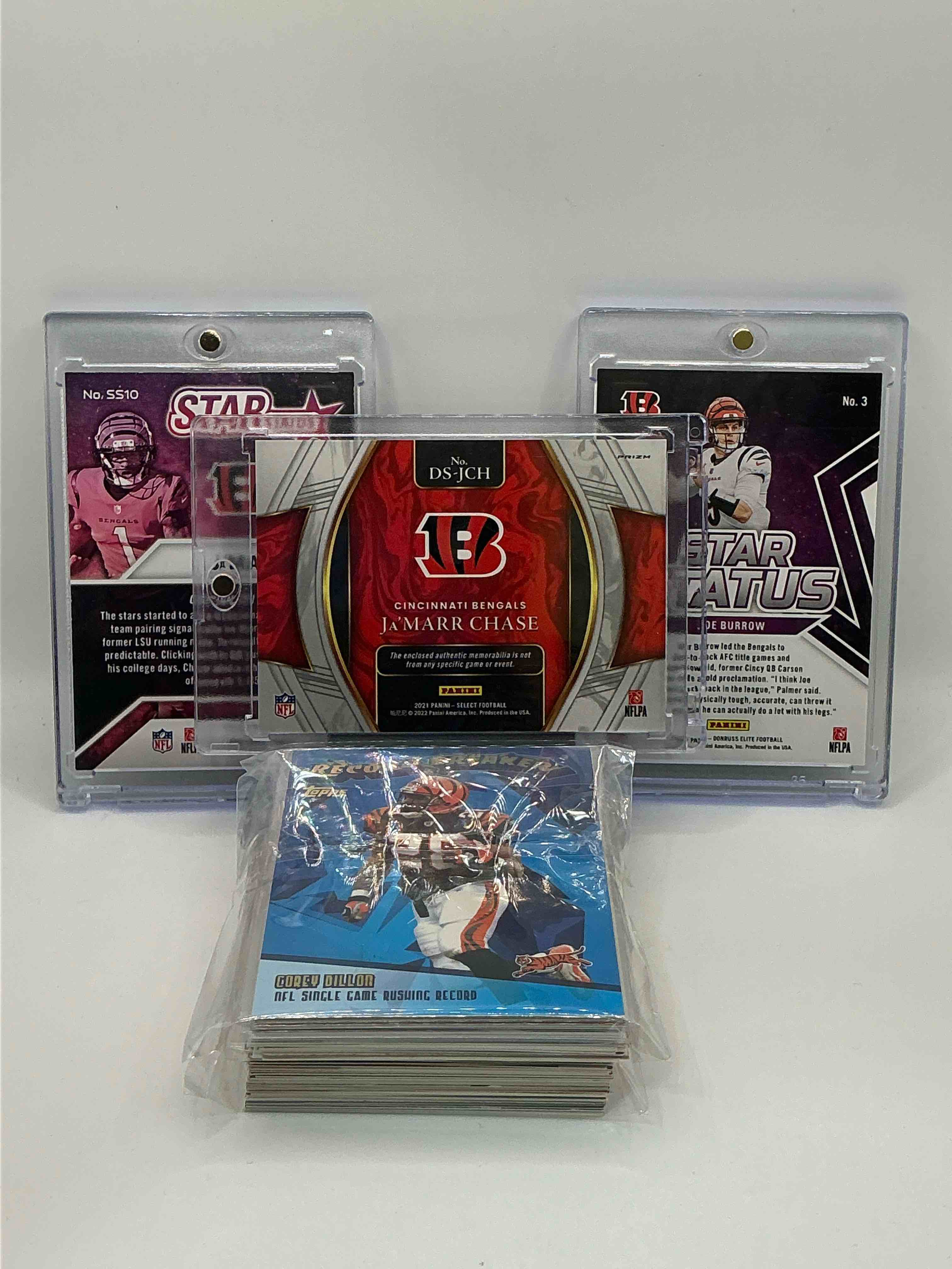 Condition photo showing New/Like New for Bengals Bonanza! 2021Select Draft Selections Silver Patch Rookie Ja’marr Chase! 2022 Donruss Elite Star Status Ja’marr Chase! 2023 Donruss Elite Star Status Joe Burrow! Along With 50 Other Bengals Heroes, Legends, Rookies & Commons!