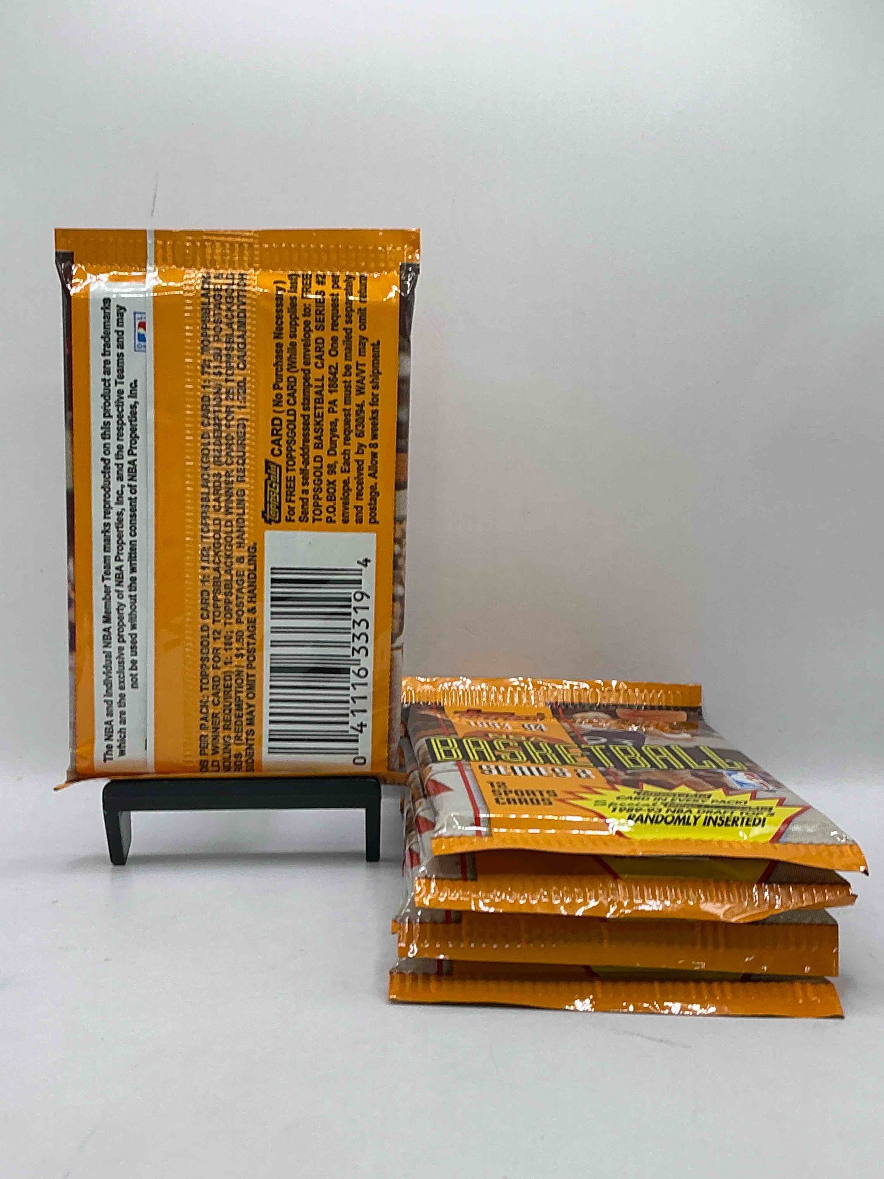 Condition photo showing New/Like New for NBA Bonanza! 1993- 94 Topps Basketball Packs! 12 Premium Basketball Cards In Each Pack! Search For Legends & Rookies Alike! Look For Michael Jordan, Shag O'Nell, Hakeem Olajuwon & More Ist Day Issue Cards, Frequent Flyer Cards, Members Only Cards & Rookies From Hardaway & Webber! Possible Pippen, Magic, Jordan, Robinson, Shaq, Olajuwon, Ewing & So Much More!