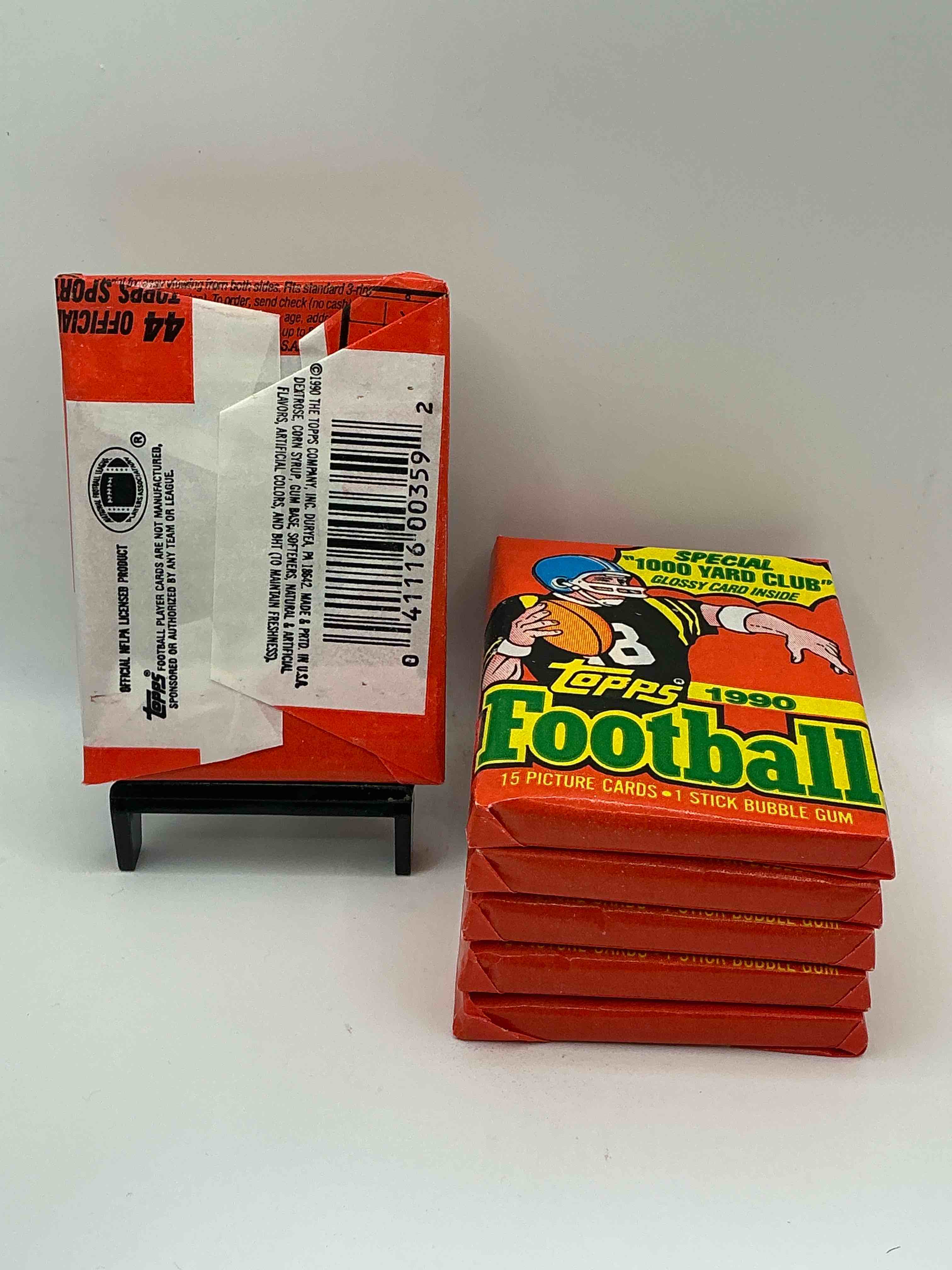 Condition photo showing New/Like New for The Last Year Of Football Wax! Joe Montana, Emmitt Smith & Barry Sanders!? 1990 Topps Football Unopened Sports Card Wax Pack, Direct From Original Retail Box! Getting Hard To Find! Search For Early Barry Sanders & Jerry Rice & So Much More!