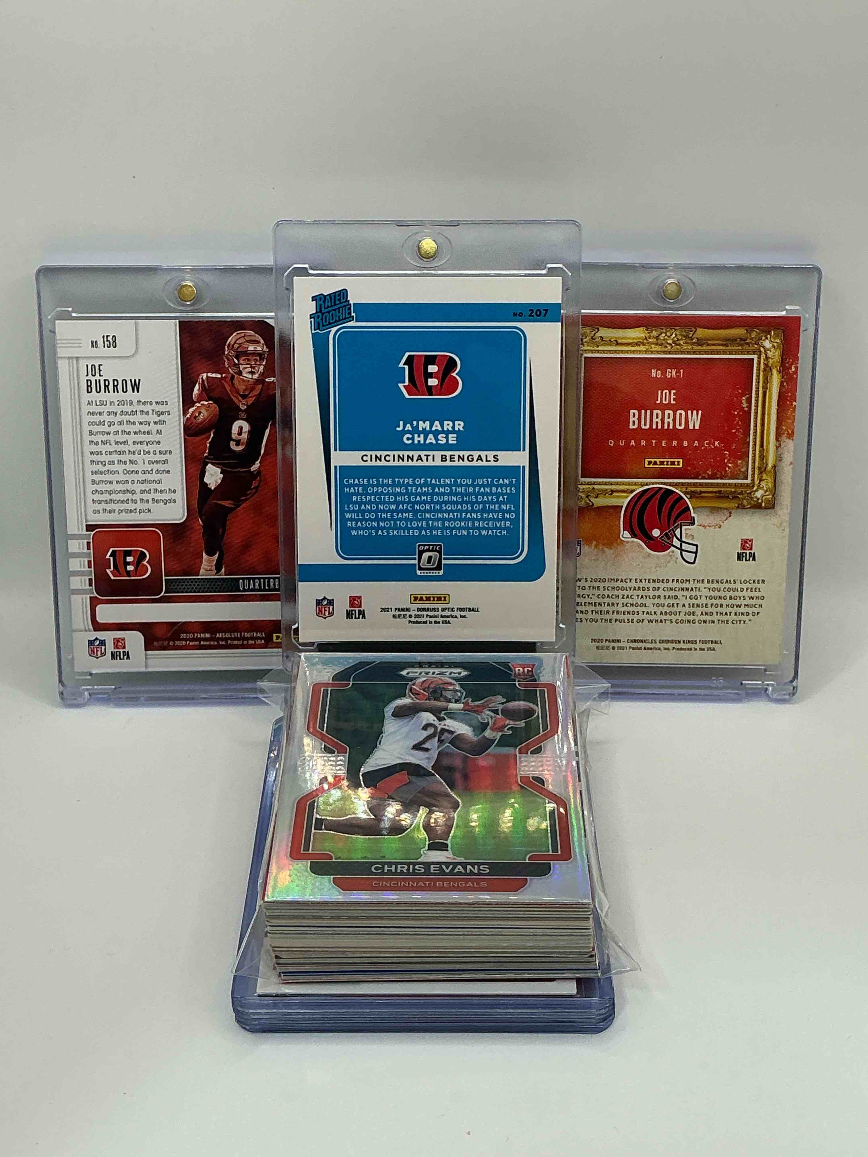 Condition photo showing New/Like New for Bengals Bonanza! 2021 Donruss Optic Rated Rookie Ja’marr Chase! 2020 Gridiron Kings Rookie Joe Burrow! 2020 Absolute Football Rookie Joe Burrow! Along With 50 Other Bengals Heroes, Rookies, Legends & Commons!
