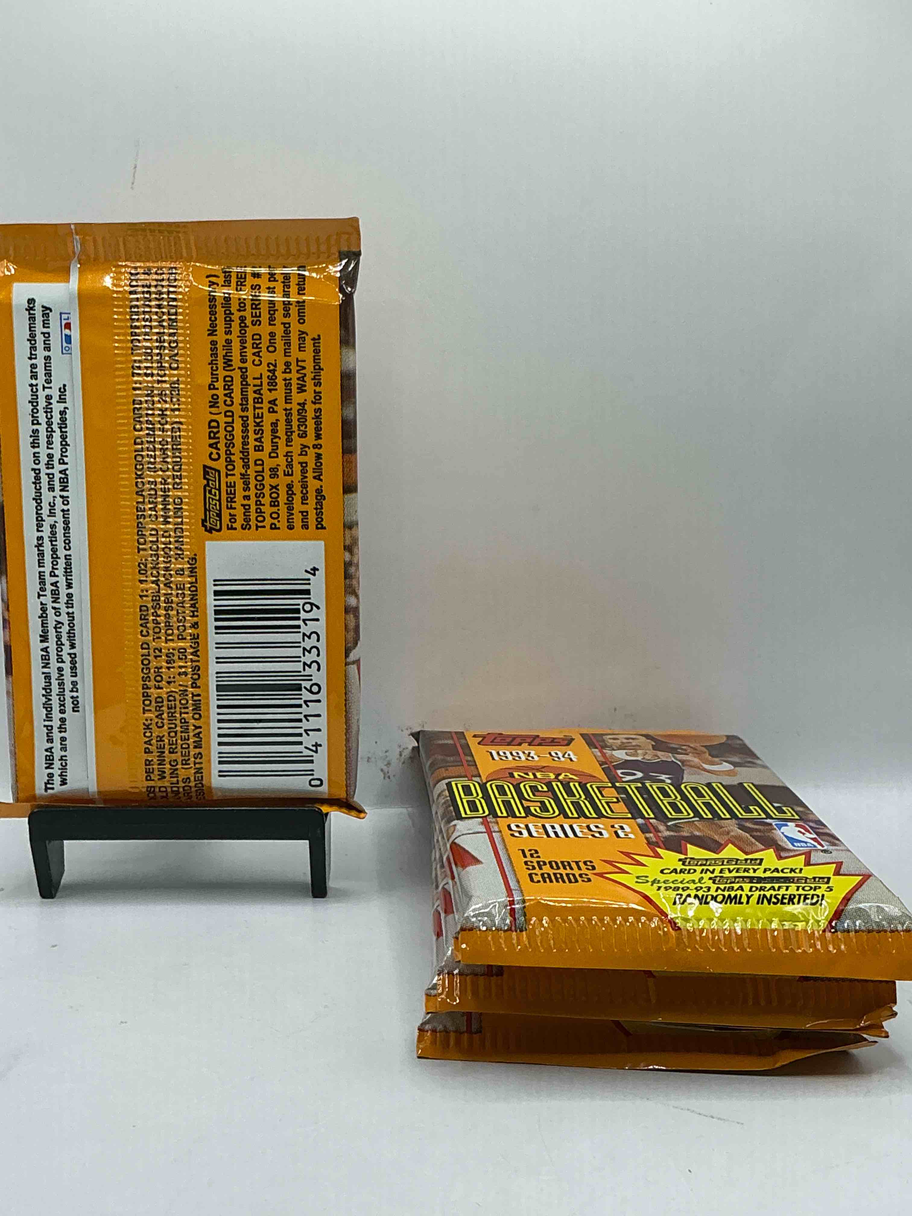 Condition photo showing New/Like New for NBA Bonanza! 1993- 94 Topps Basketball Packs! 12 Premium Basketball Cards In Each Pack! Search For Legends & Rookies Alike! Look For Michael Jordan, Shag O'Nell, Hakeem Olajuwon & More Ist Day Issue Cards, Frequent Flyer Cards, Members Only Cards & Rookies From Hardaway & Webber! Possible Pippen, Magic, Jordan, Robinson, Shaq, Olajuwon, Ewing & So Much More!