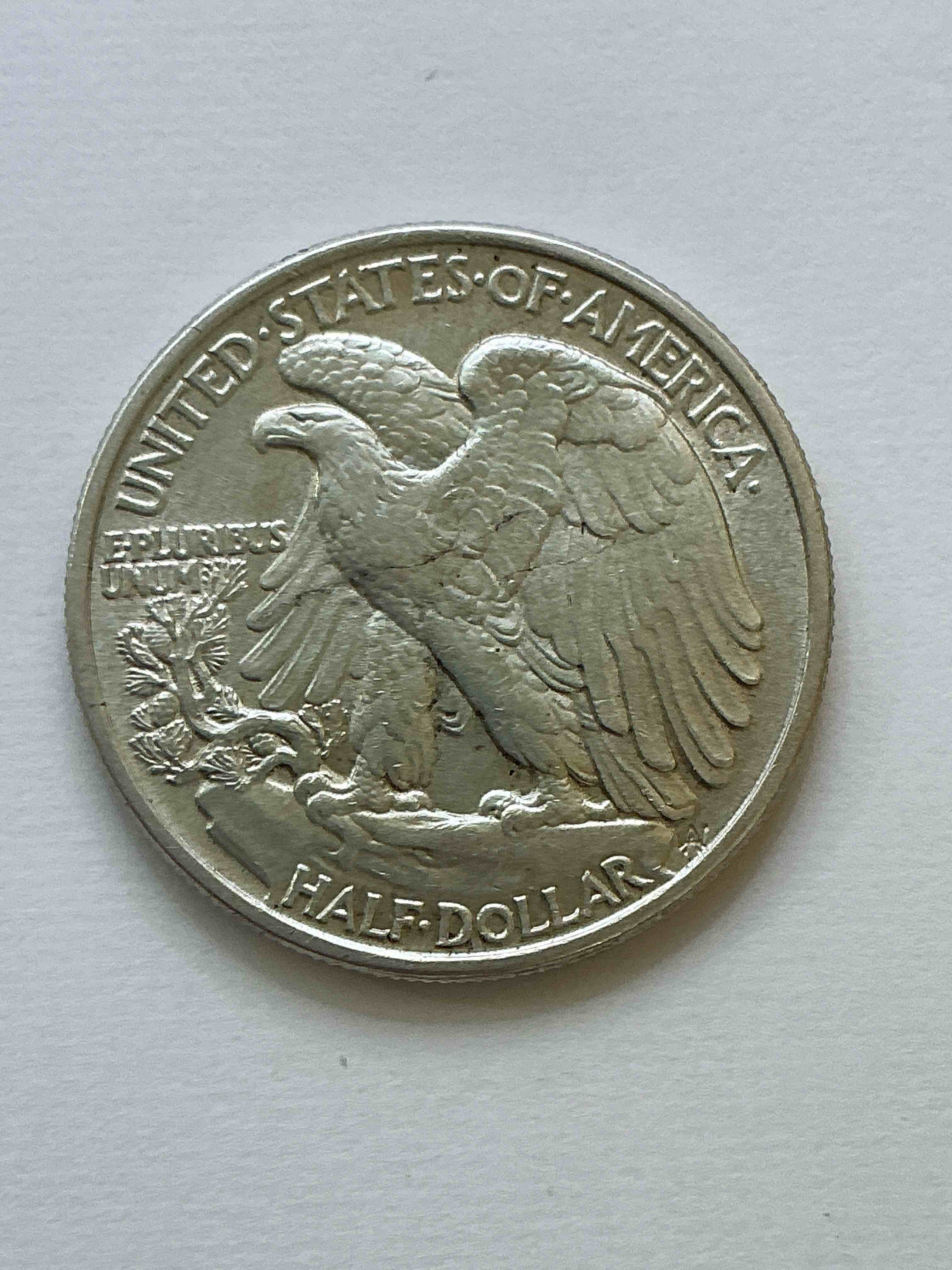 Condition photo showing New/Like New for World War II Era Silver! Antique U.S. Silver! Liberty Walking Silver Half Dollar! This Striking Half Dollars Were Minted From 1916-1947 & Have Become Some Of The Most Collectible Coins In History! Here Is A Striking, Appears Uncirculated, Examples From 1943! Liberty Walking Coins Are 90% Fine U.S. Silver, A Great Investment In Precious Metal!