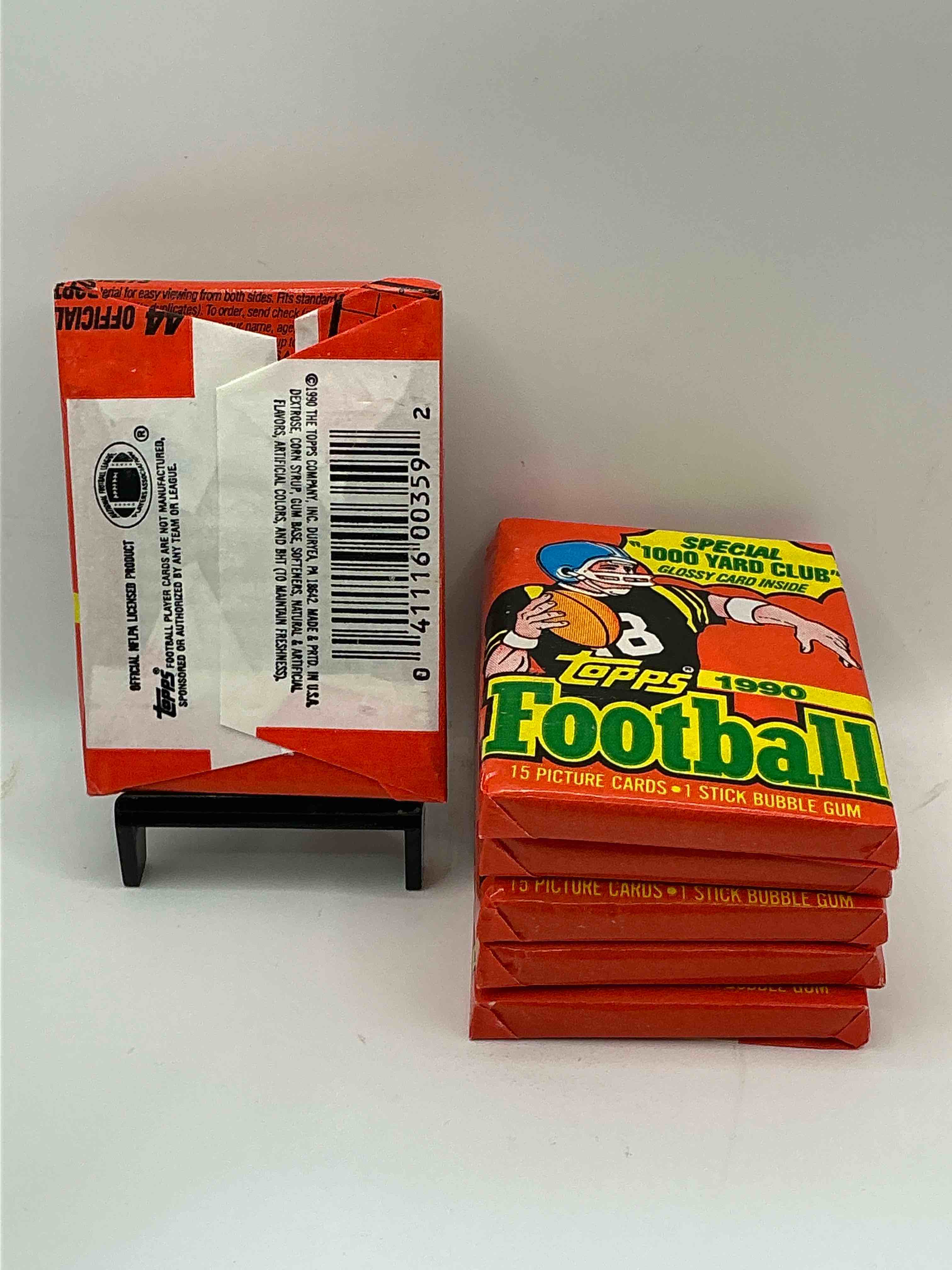 Condition photo showing New/Like New for The Last Year Of Football Wax! Joe Montana, Emmitt Smith & Barry Sanders!? 1990 Topps Football Unopened Sports Card Wax Pack, Direct From Original Retail Box! Getting Hard To Find! Search For Early Barry Sanders & Jerry Rice & So Much More!