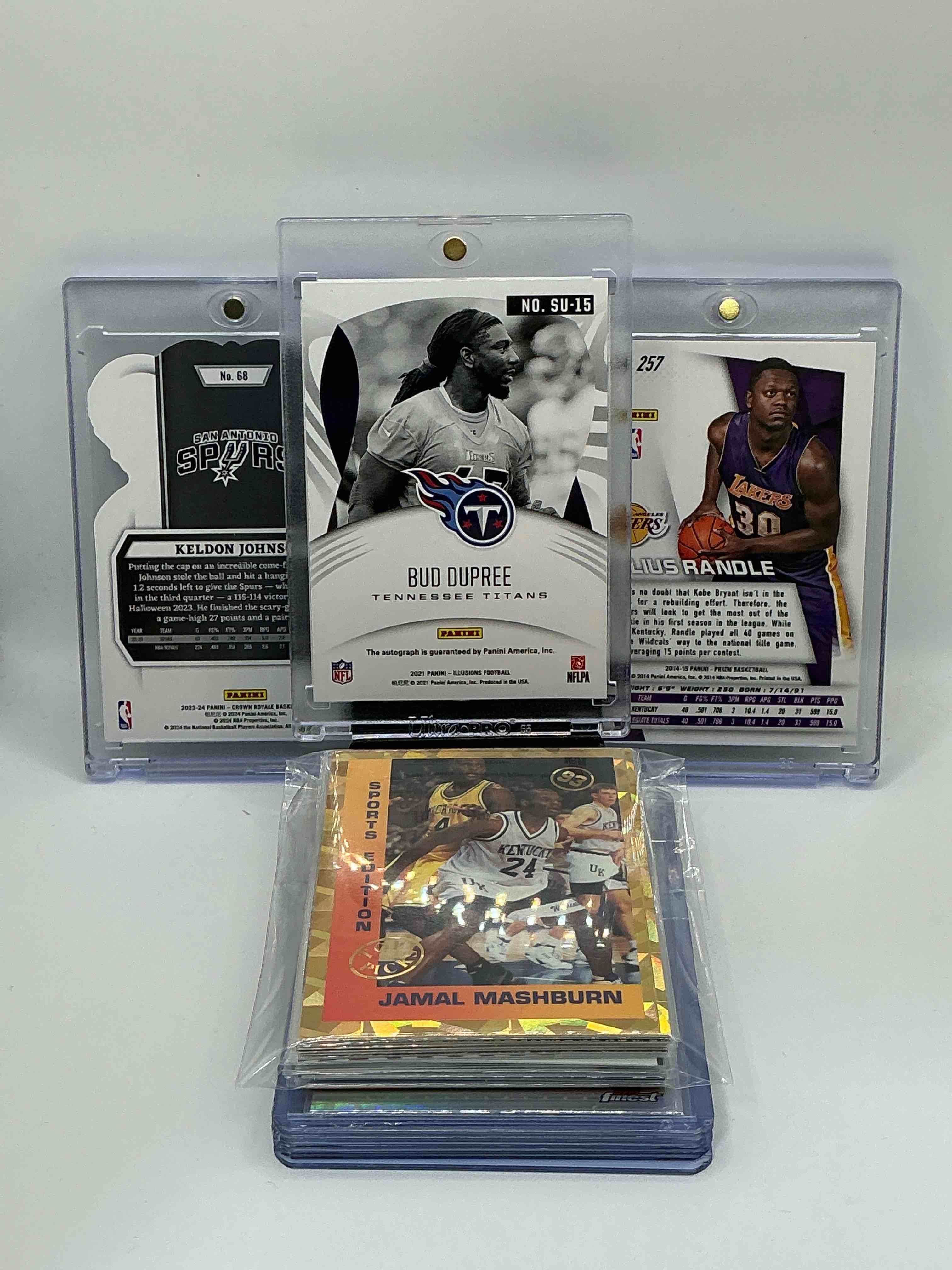 Condition photo showing New/Like New for Kentucky Wildcat Craziness! Some Of The Best Wildcats Of All Time! 2021 Panini Illusions Silver Superlatives Autograph Bud Dupree Numbered 53/75! 2023 Crown Royale Silver Die-Cut Keldon Johnson Numbered 11/99! 2014 Prizm Rookie Julius Randle! Along With 20 Other University Of Kentucky Basketball & Football Legends!