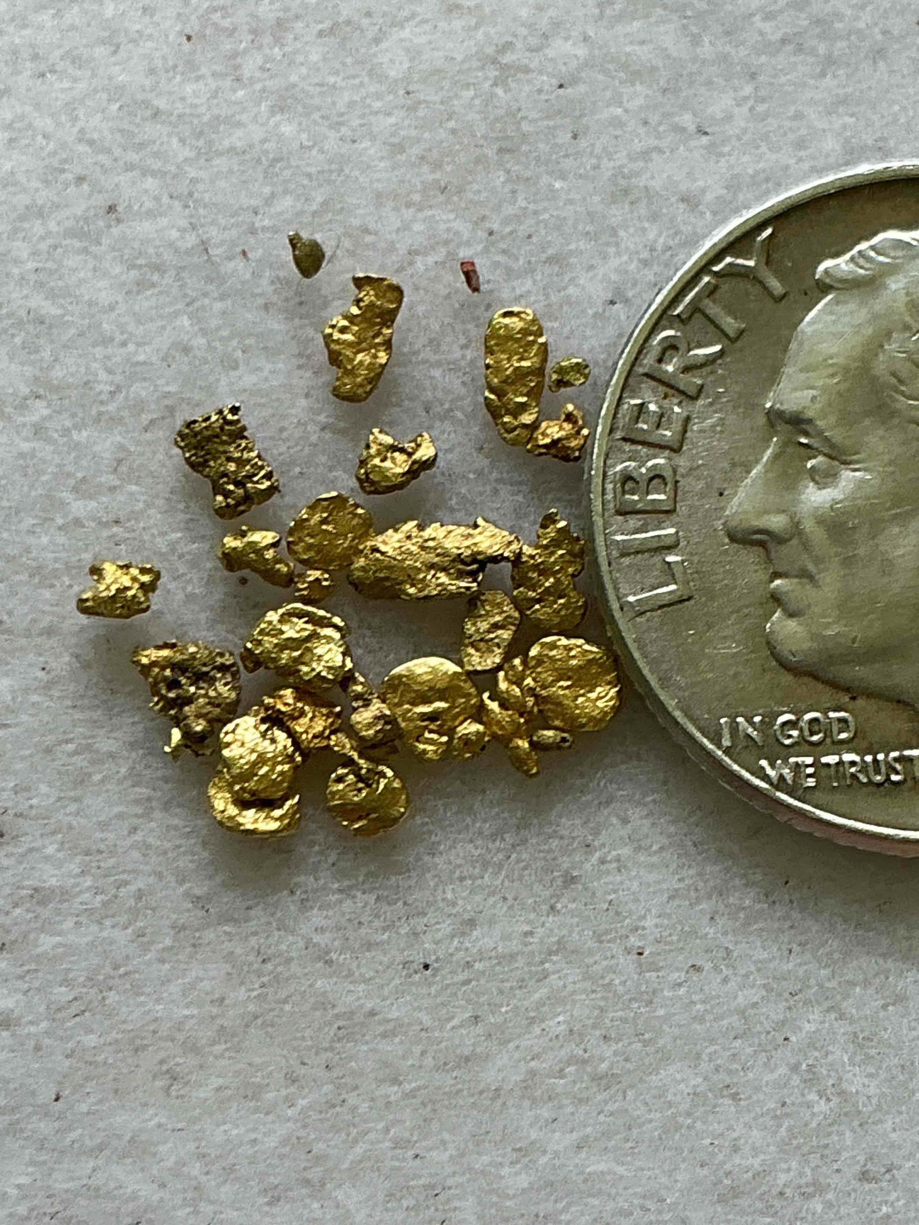 Condition photo showing New/Like New for Genuine Gold Nuggets! Gold Nuggets Fresh From Prospecting North Carolina Mountains, Total Weight Of All Nuggets Is Approximately .5 Grams. These Gold Nuggets Typically Test At Between Approx 22-24 Karat. Gold In Raw, Prospected Form Is Extremely Hard To Find & Much Rarer Than Any Refined Form. Get In On The Gold Craze... Gold Has Increased In Value Over 40% Since 2025! U.S. Dime For Size Reference Only (not included). Gold Vile In Image Included. Own Genuine, Gold Nuggets!