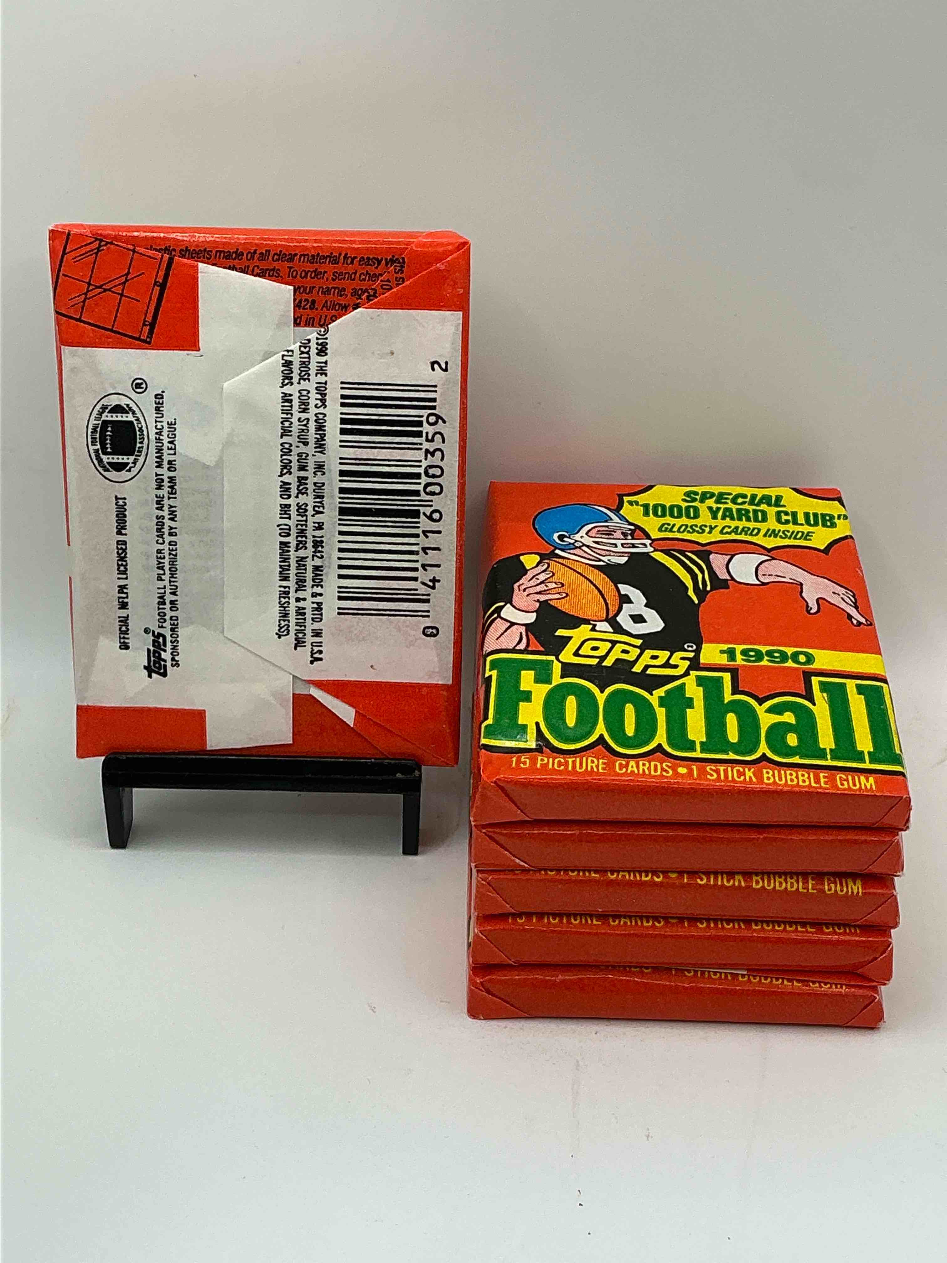 Condition photo showing New/Like New for The Last Year Of Football Wax! Joe Montana, Emmitt Smith & Barry Sanders!? 1990 Topps Football Unopened Sports Card Wax Pack, Direct From Original Retail Box! Getting Hard To Find! Search For Early Barry Sanders & Jerry Rice & So Much More!