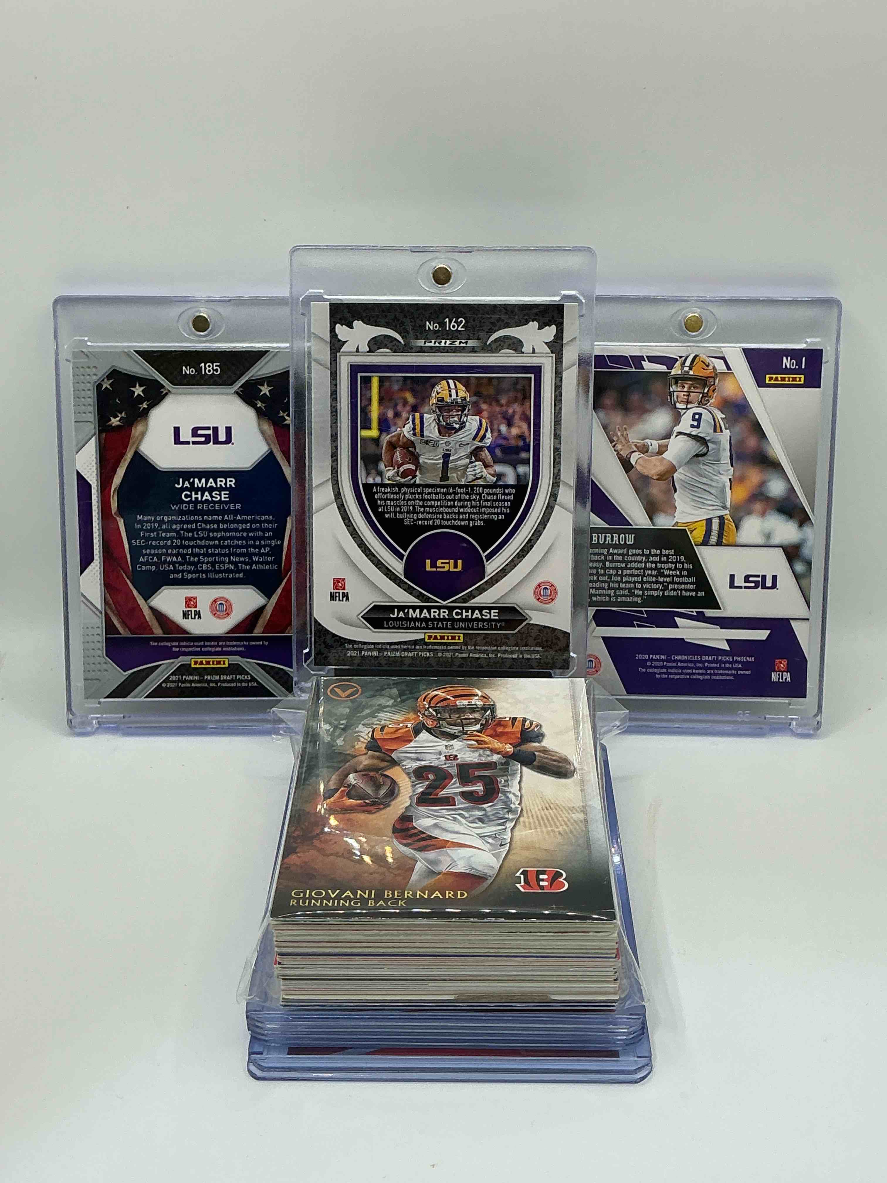 Condition photo showing New/Like New for Bengals Bonanza! 2021 Prizm Draft Draft Picks Silver “Crusade” Rookie Ja’marr Chase! 2020 Phoenix Draft Picks Rookie Joe Burrow! 2021 Prizm Draft Picks “All-Americans” Rookie Ja’marr Chase! Along With 50 Other Bengals Heroes, Legends, Rookies & Commons!