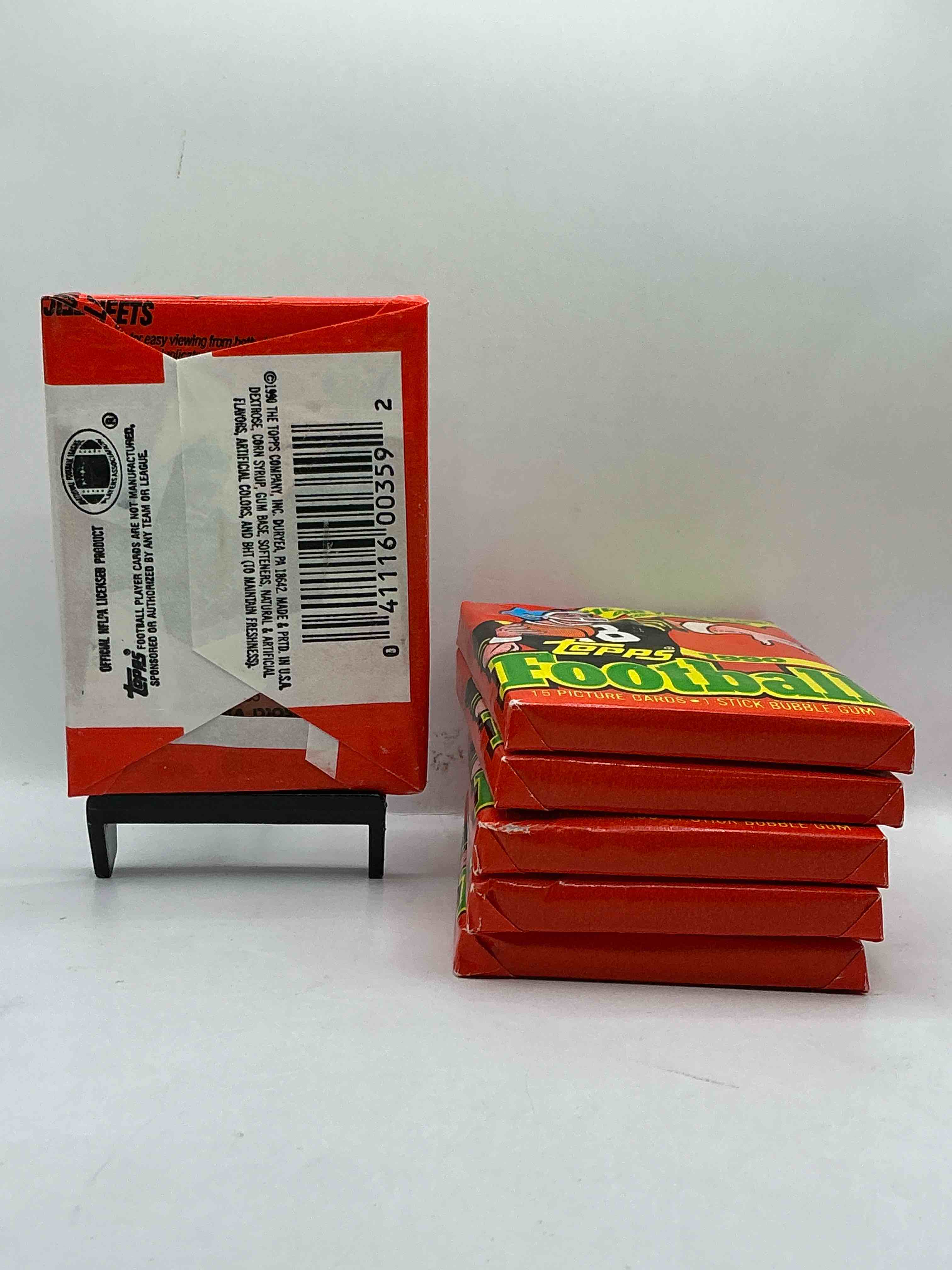 Condition photo showing New/Like New for The Last Year Of Football Wax! Joe Montana, Emmitt Smith & Barry Sanders!? 1990 Topps Football Unopened Sports Card Wax Pack, Direct From Original Retail Box! Getting Hard To Find! Search For Early Barry Sanders & Jerry Rice & So Much More!
