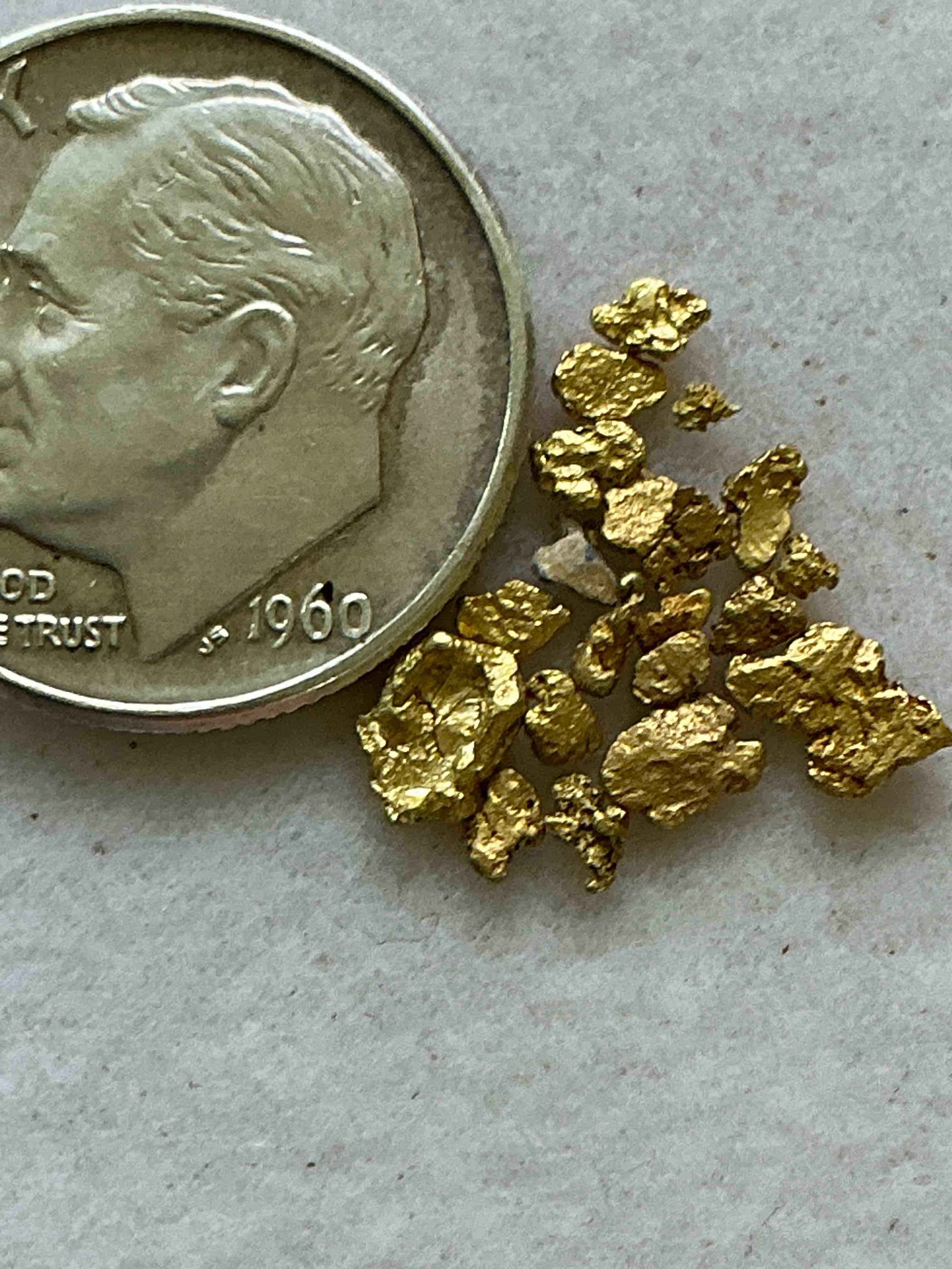 Condition photo showing New/Like New for Genuine Gold Nuggets! Gold Nuggets Fresh From Prospecting North Carolina Mountains, Total Weight Of All Nuggets Is Approximately .5 Grams. These Gold Nuggets Typically Test At Between Approx 22-24 Karat. Gold In Raw, Prospected Form Is Extremely Hard To Find & Much Rarer Than Any Refined Form. Get In On The Gold Craze... Gold Has Increased In Value Over 40% Since 2025! U.S. Dime For Size Reference Only (not included). Gold Vile In Image Included. Own Genuine, Gold Nuggets!