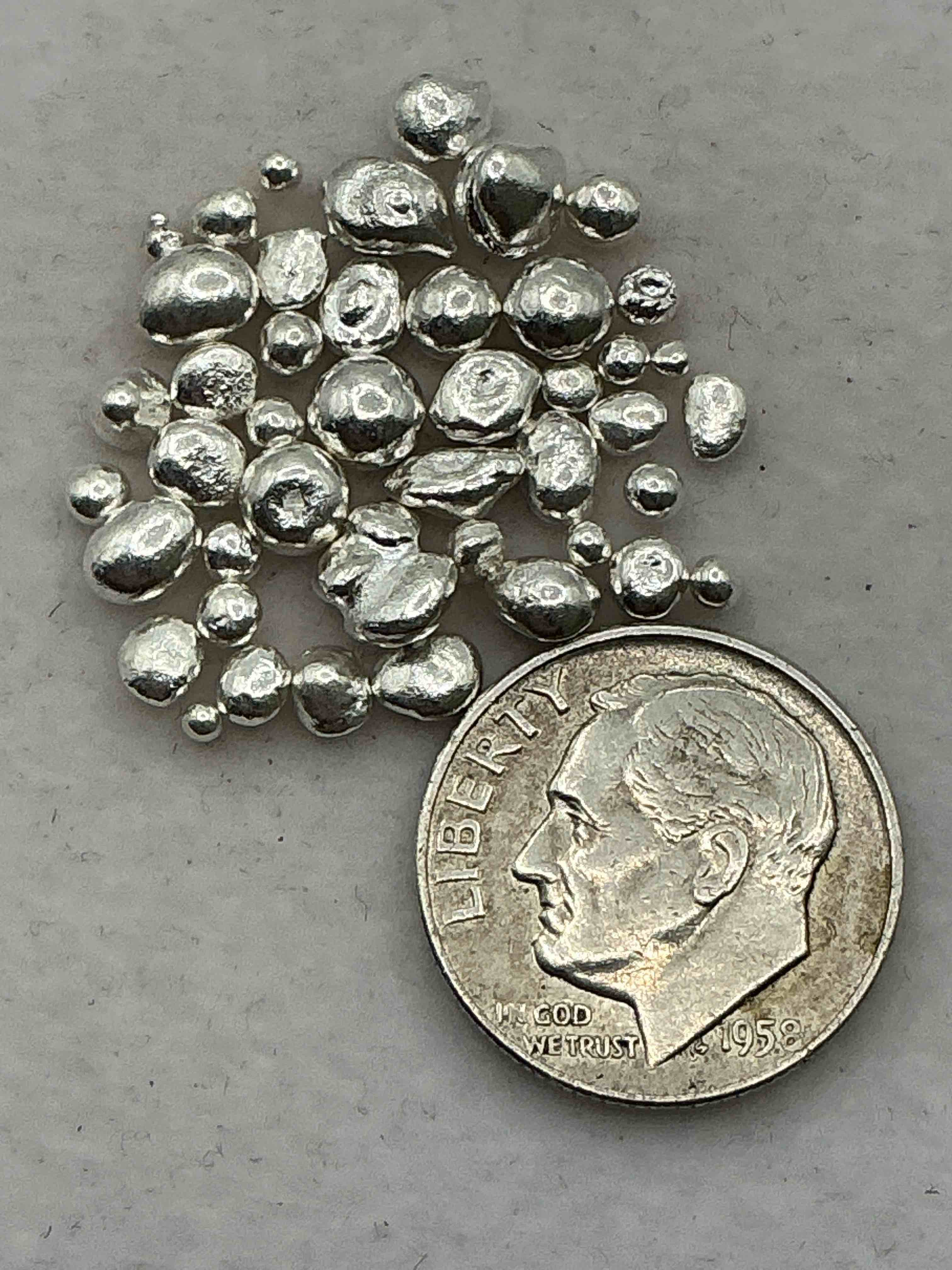 Condition photo showing Good Condition for Silver Nuggets! .999 US Fine Silver, In Small Nugget Form! Total Weight Of All Nuggets In Lot Approximately 6 Grams, Bid Is Per Nugget! A Cool Way To Invest In Fine US Silver! Includes Collector Capsule!