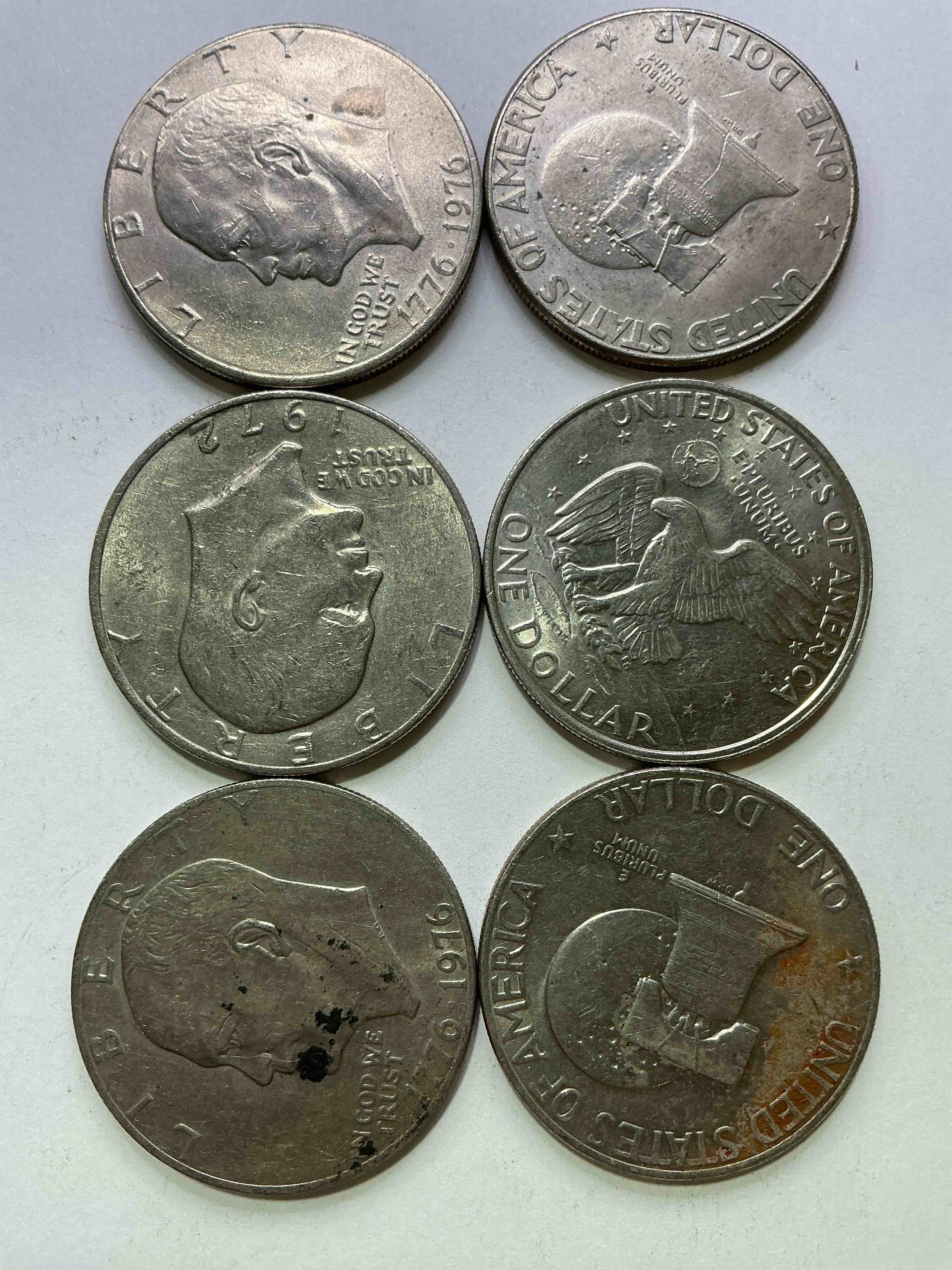 Condition photo showing Good Condition for Gorgeous Eisenhower Dollar Coins! These Striking, Large U.S. Coins Were Minted From 1971-1978. Here Are Gorgeous Examples Of “Ike" Dollars From 1976 & Other Years! These Coins Have Become Immensely Popular With Collectors & Some Have Great Toning!