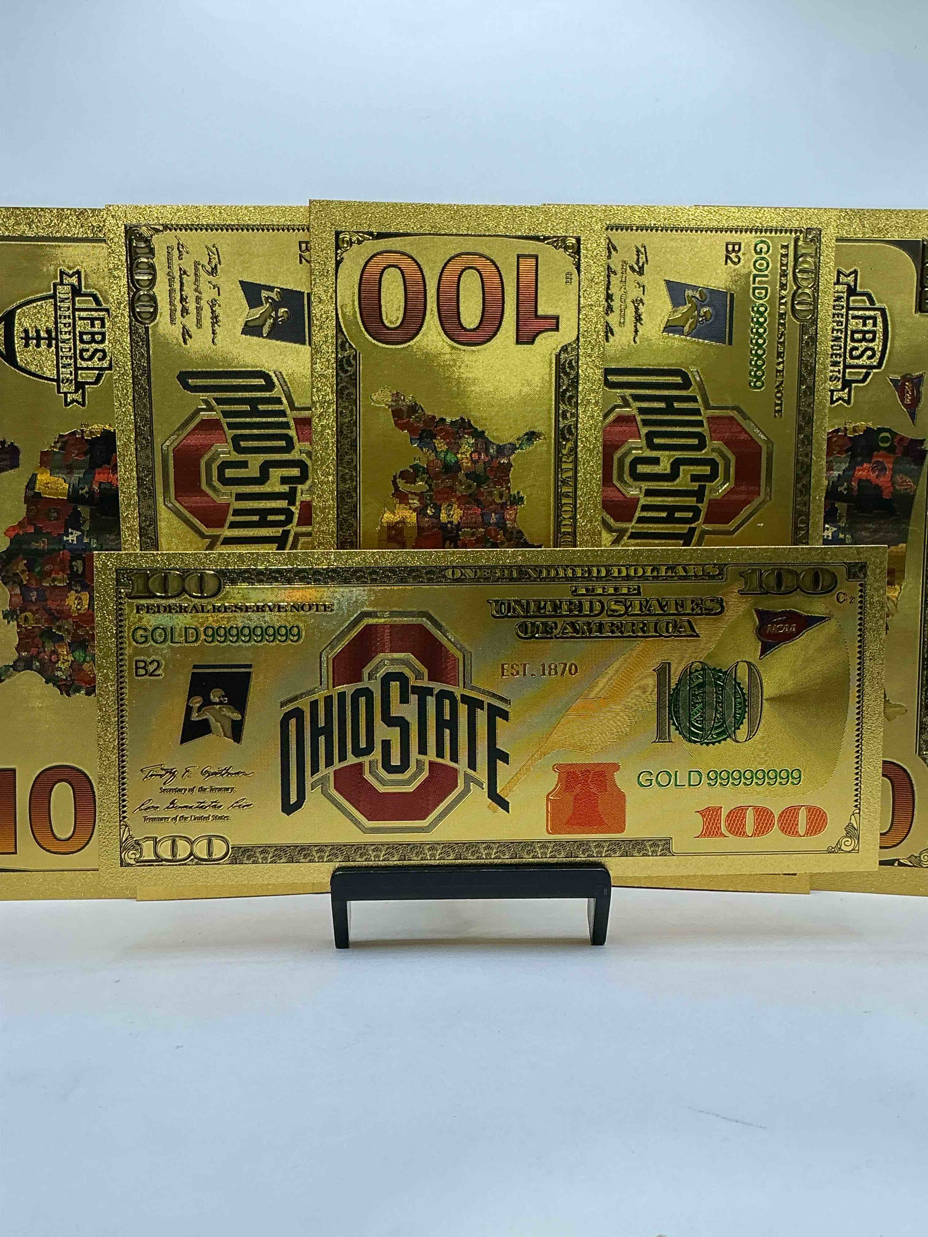 Condition photo showing New/Like New for Ohio State University Collectible Memorabilia! Super Cool, Gold In Color 100 Dollar Commemorative Ohio State University Bill! Cool Designs On Front & Back Of Bill! OSU Fans Rejoice, Cool Memorabilia! Plastic Bills With Cool Designs! 