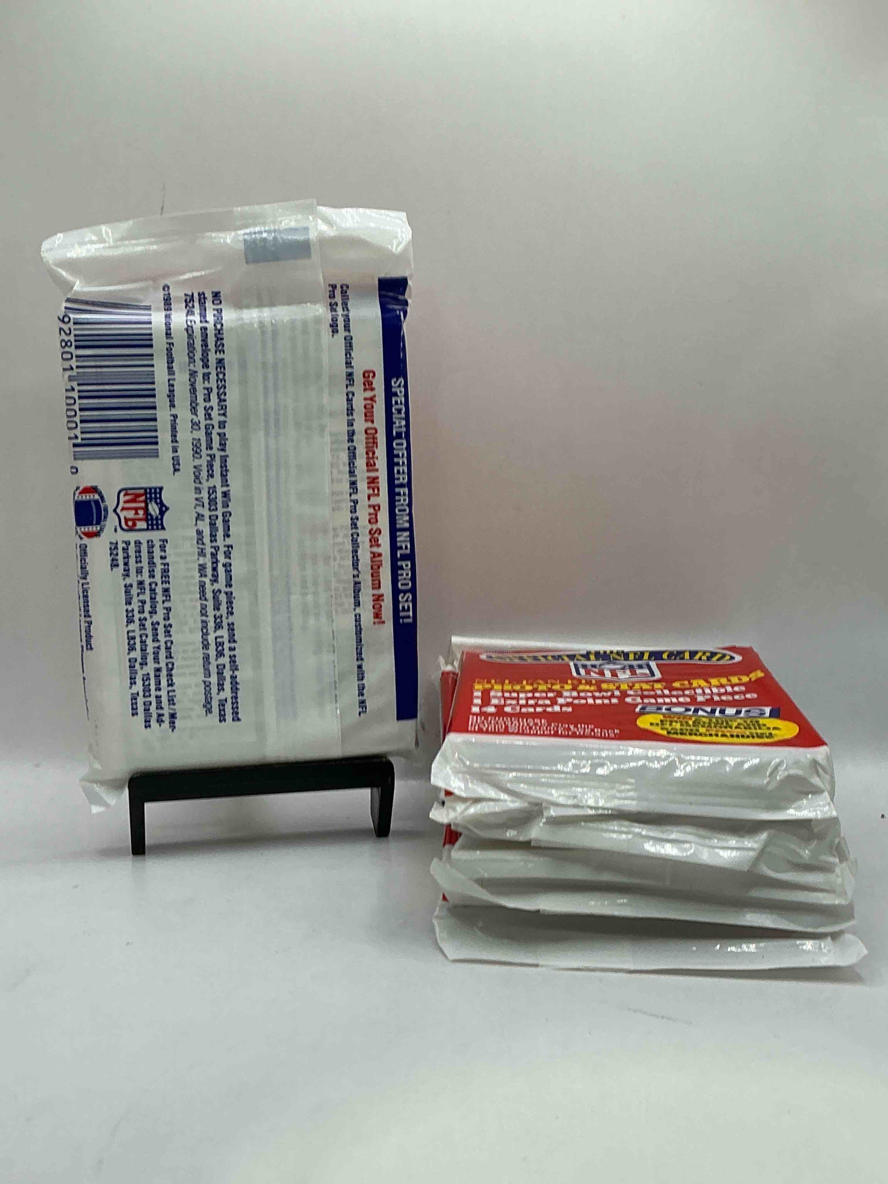 Condition photo showing New/Like New for Loaded! 1989 Pro Set Football Sealed Card Pack, Direct From Original Retail Case!Highly Sought After By Collectors As This Year Is Loaded With High Profile Rookies!Search For Rookie Cards From Barry Sanders, Deion Sanders, Troy Aikman, Michael Irvin & Much More! Getting Hard To Find!