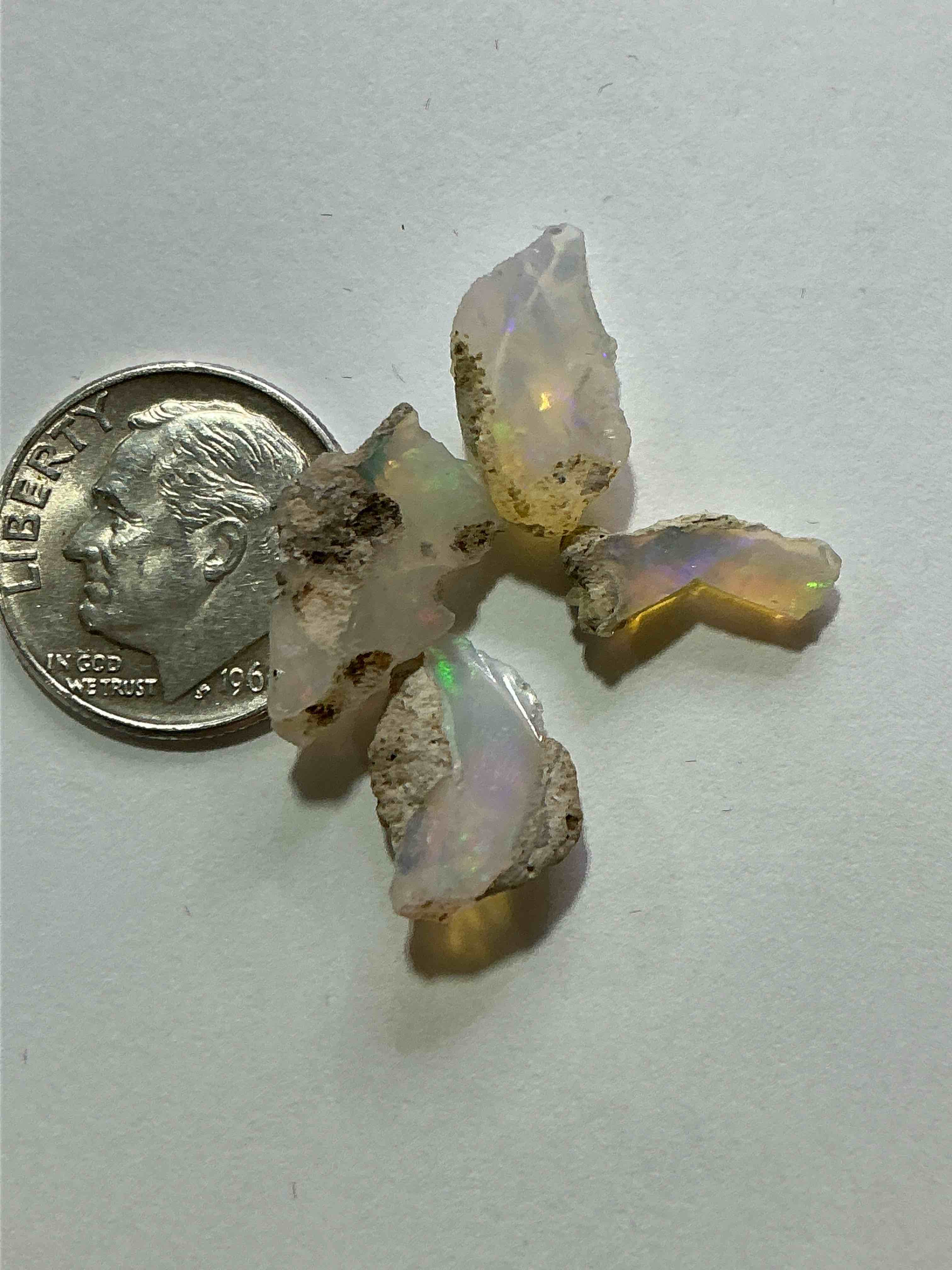 Condition photo showing New/Like New for Opal Precious Gemstone, Raw, Authentic! Ethiopian Opal Gemstone, In Large & Raw, Prospected Form! Ethiopian Opals Are Famous For Their Stunning Clarity & Shimmering Color Hues! They Are Believed To Promote Hope, Purity & Love. The U.S. Dime In Image Is For Size Reference Only (Not Included). A Gemstone Like This In Raw Form Is Very Hard To Find! Own An Amazing, Stunning, Unique Opal Gemstone In Rare, Raw Form!