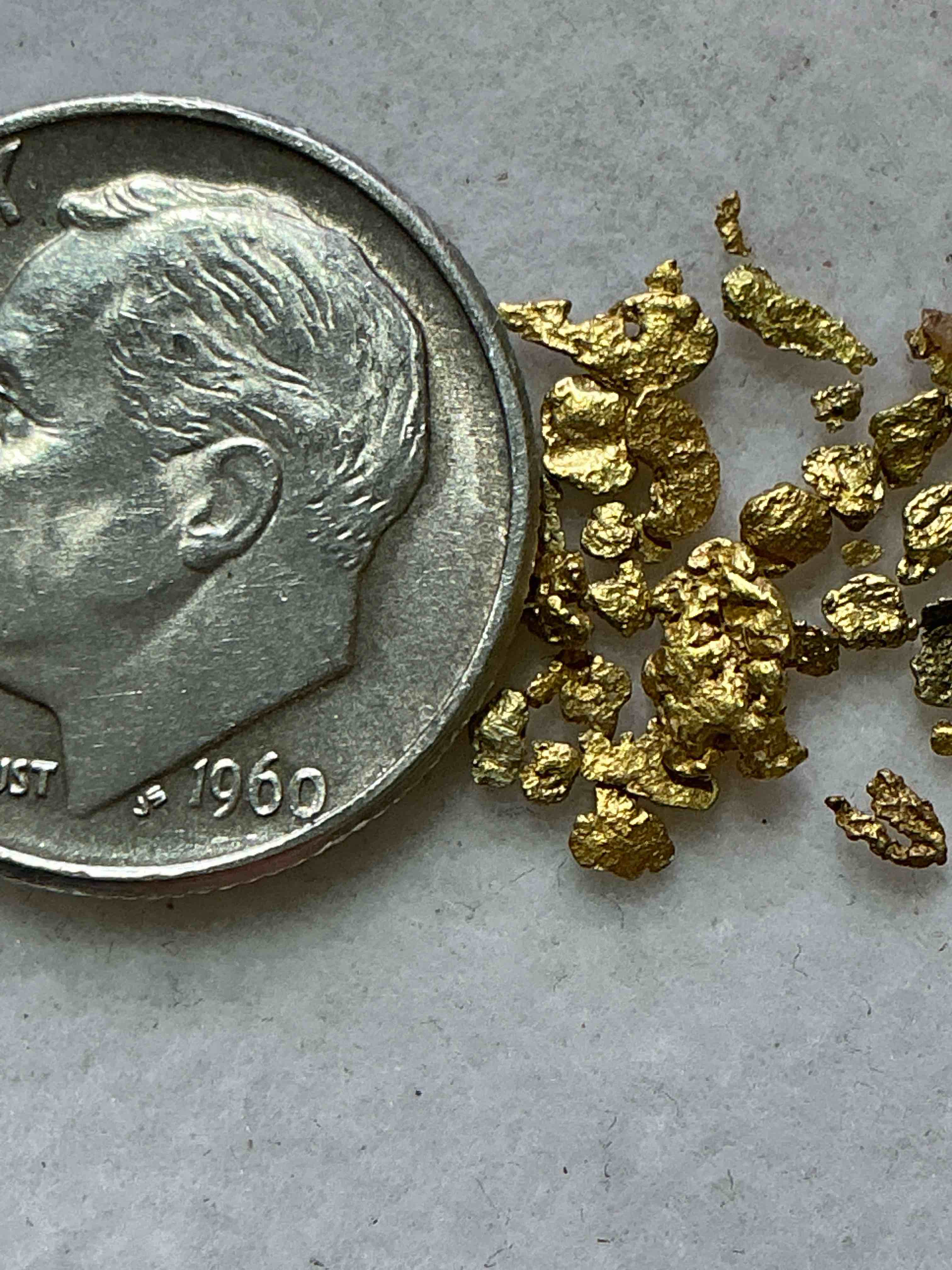 Condition photo showing New/Like New for Genuine Gold Nuggets! Gold Nuggets Fresh From Prospecting North Carolina Mountains, Total Weight Of All Nuggets Is Approximately .5 Grams. These Gold Nuggets Typically Test At Between Approx 22-24 Karat. Gold In Raw, Prospected Form Is Extremely Hard To Find & Much Rarer Than Any Refined Form. Get In On The Gold Craze... Gold Has Increased In Value Over 40% Since 2025! U.S. Dime For Size Reference Only (not included). Gold Vile In Image Included. Own Genuine, Gold Nuggets!