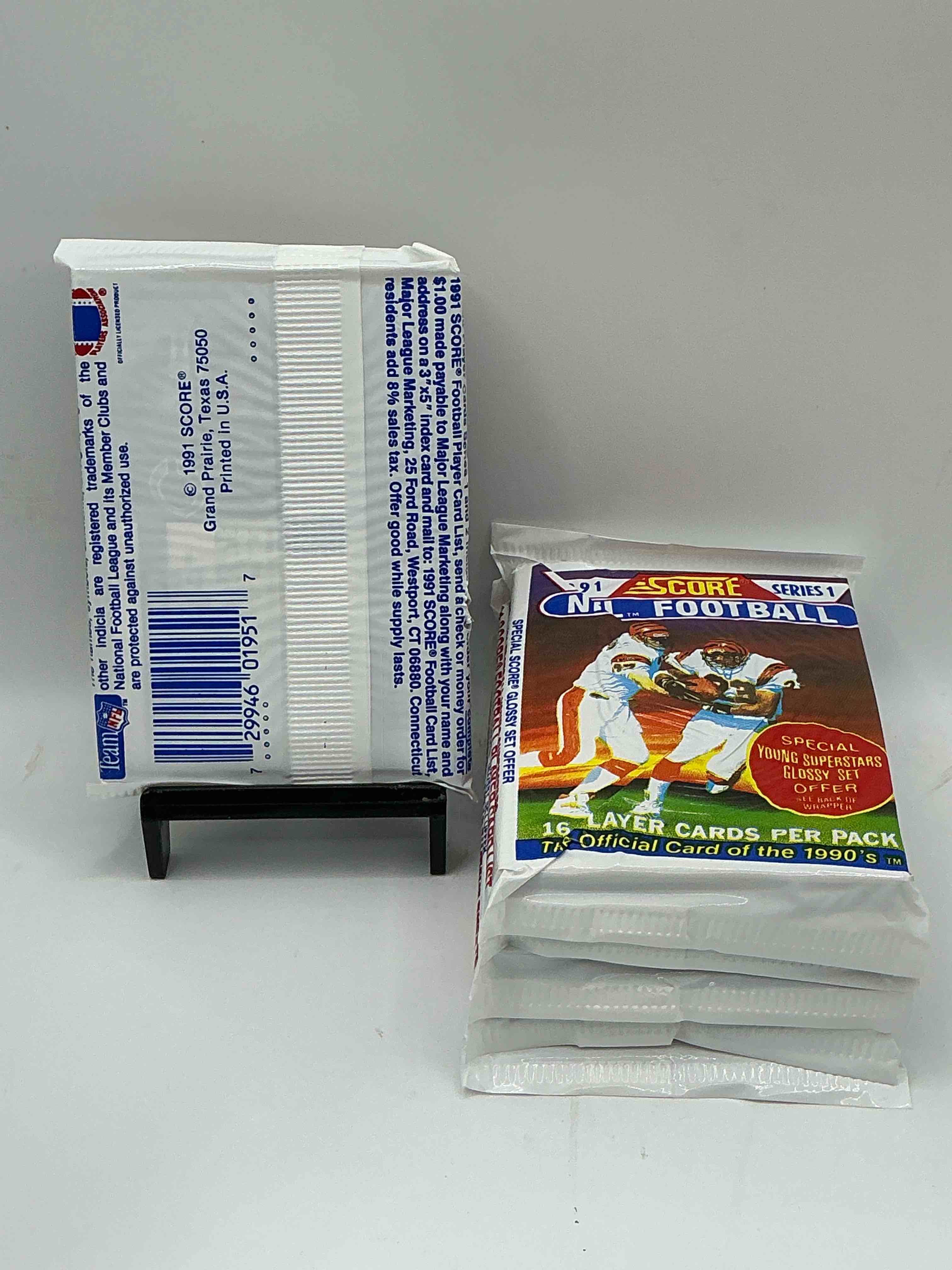 Condition photo showing New/Like New for 1991 NFL Score Football Sealed Card Packs Series I Direct From Original Retail Case! These Cards Are Sought After By Collectors For Their Awesome, Nostalgic Look. Search For Brett Favre Rookie, Early Jerry Rice, Early Emmit Smith, Joe Montana & So Much More!