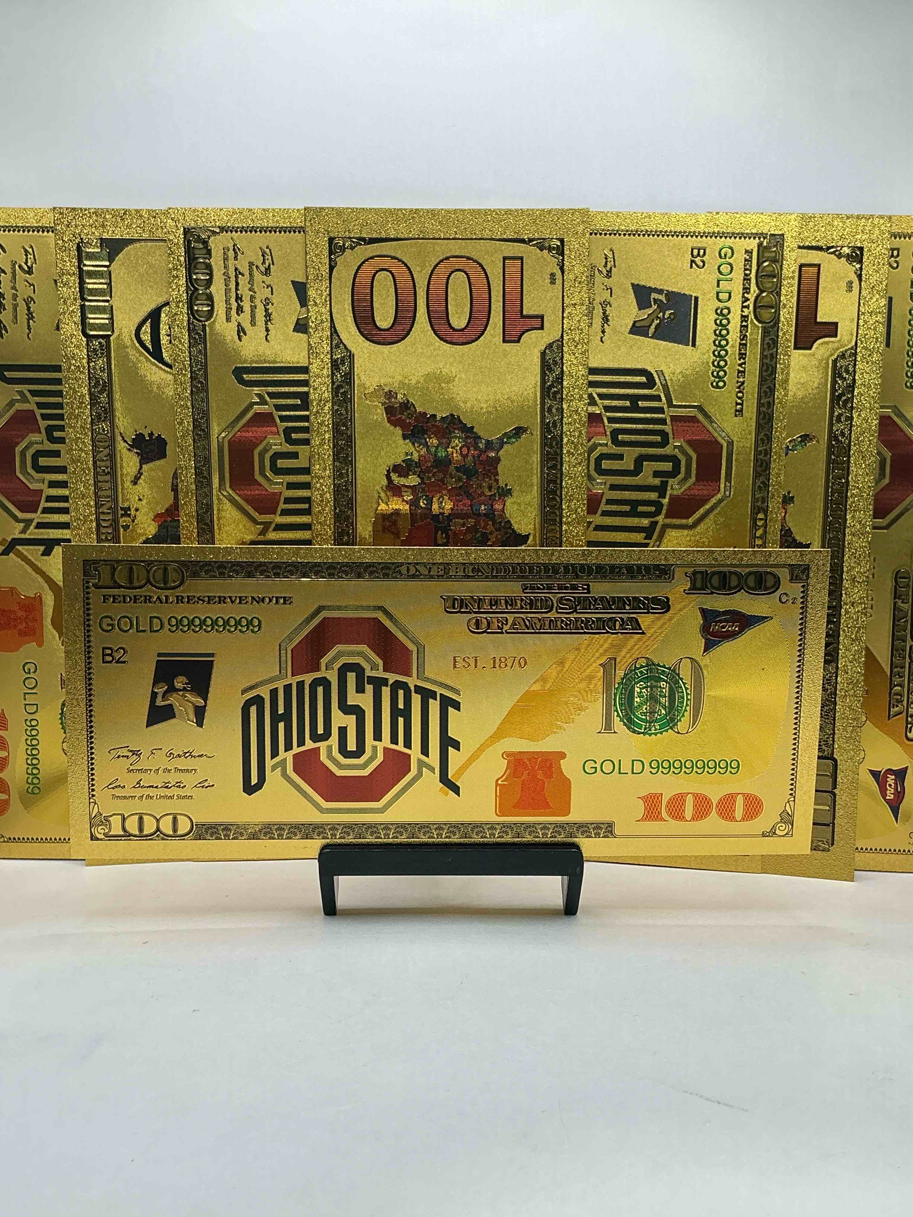 ohio state university collectible memorabilia! super cool, gold in color 100 dollar commemorative ohio state university bill! cool designs on front & back of bill! osu fans rejoice, cool memorabilia! plastic bills with cool designs! 