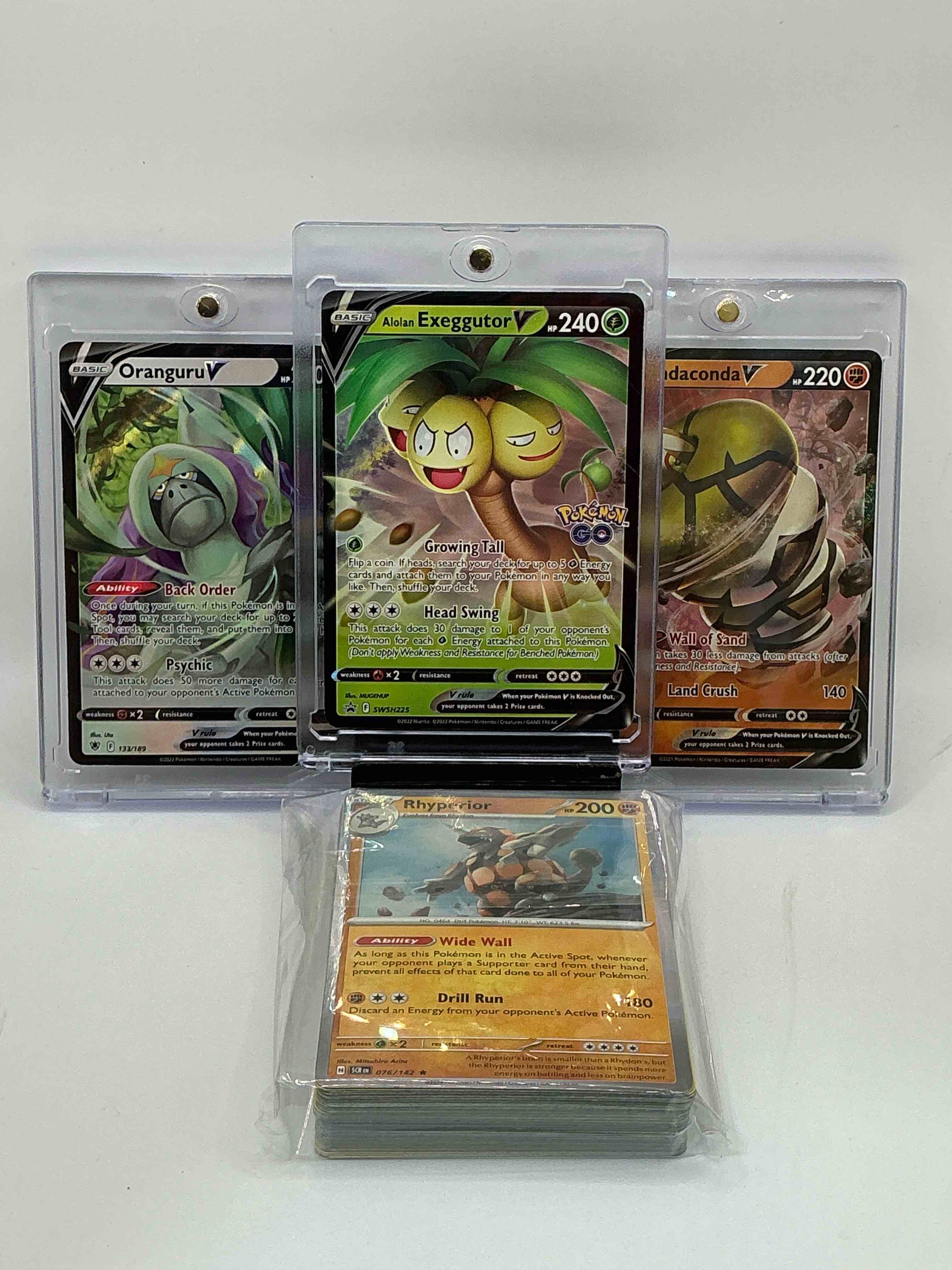 Pokémon Palooza! Alolan Exeggutor V! Sandaconda V! Oranguru V! Also Includes 1 Stage Two Rare Holographic, 2 Stage One Rare Holographic, 3 Basic Rare Holographic, 4 Common/ Uncommon Holographics (All Stages), 2 Stage Two Non Holographic & 2 Rares! Also Includes 36 Non Holo Common/ Uncommon Basic & First Stage Cards Trainers & Energy Too! Perfect Set For Collectors & Enthusiasts!