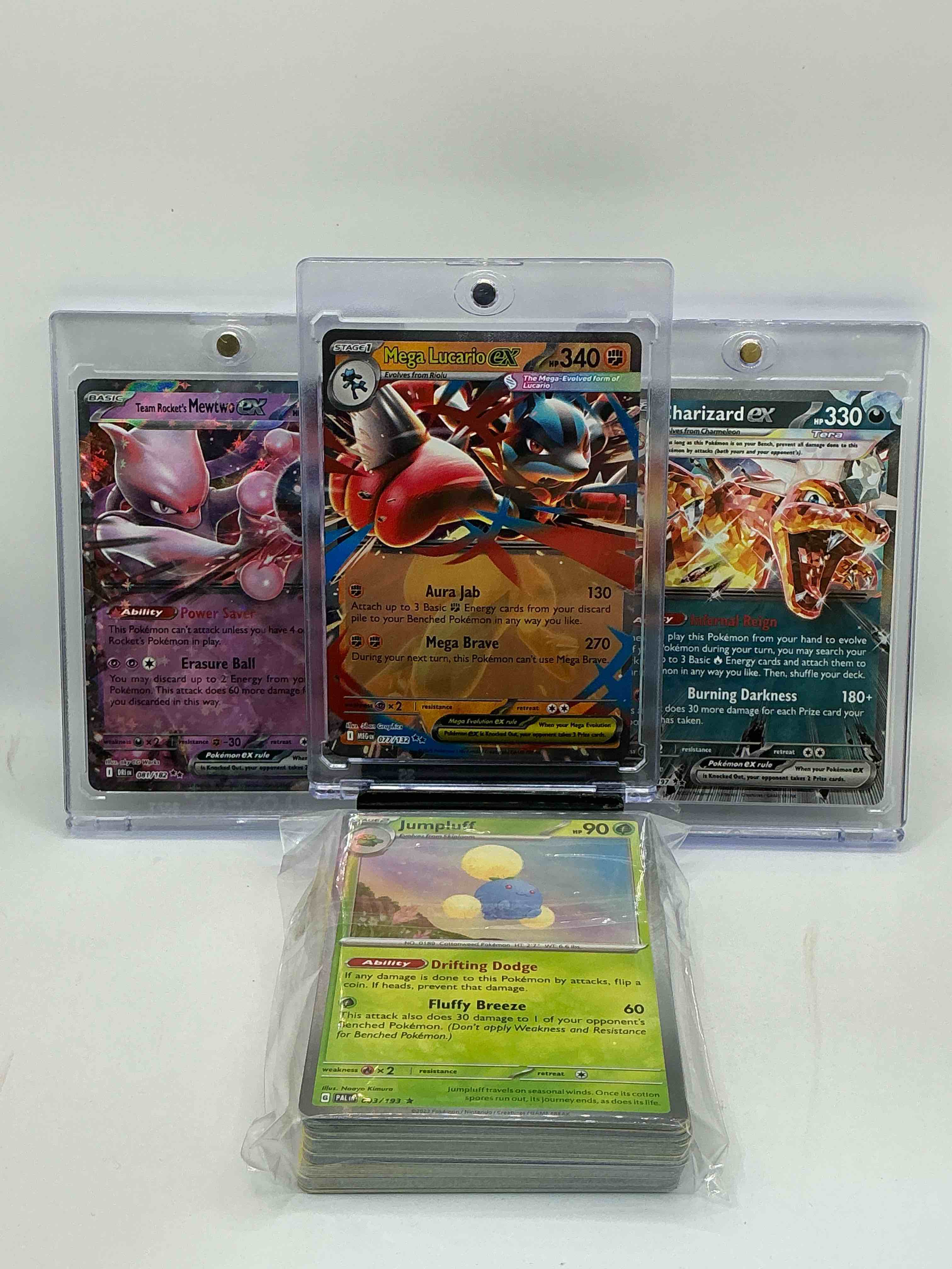 Mega Lucario EX! Charizard EX! Team Rocket’s Mewtwo EX! Along With 1 Stage Two Rare Holographic, 2 Stage One Rare Holographic, 3 Basic Rare Holographic, 4 Common/ Uncommon Holographics (All Stages), 2 Stage Two Non Holographic & 2 Rares! Also Includes 36 Non Holo Common/ Uncommon Basic & First Stage Cards Trainers & Energy Too! Perfect Set For Collectors & Enthusiasts!