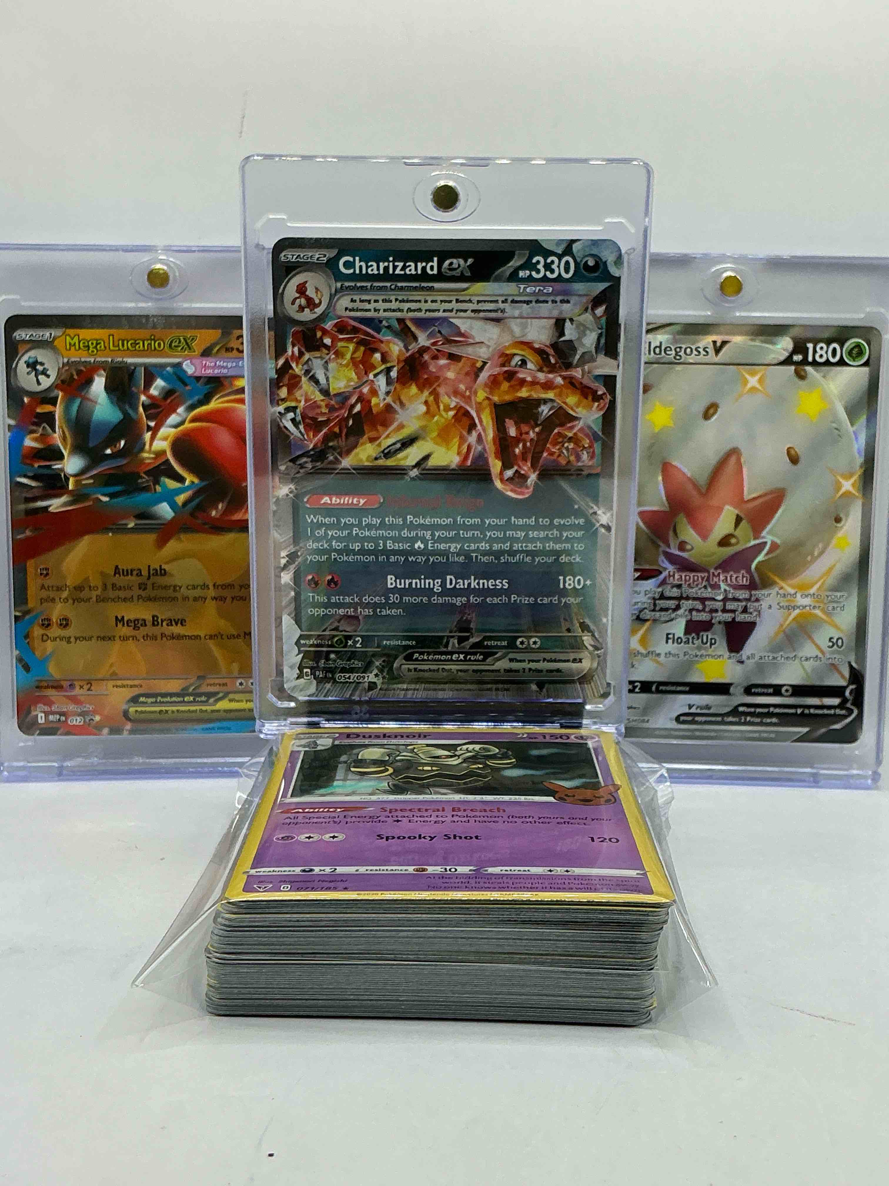 Condition photo showing New/Like New for charizard ex, mega lucario & more! pokémon palooza! this 50 card lot includes 1 stage two rare holographic, 2 stage one rare holographic, 3 basic rare holographic, 4 common/ uncommon holographics (all stages), 2 stage two non holographic & 2 rares! also includes 36 non holo common/ uncommon basic & first stage cards trainers & energy too! perfect set for collectors & enthusiasts!