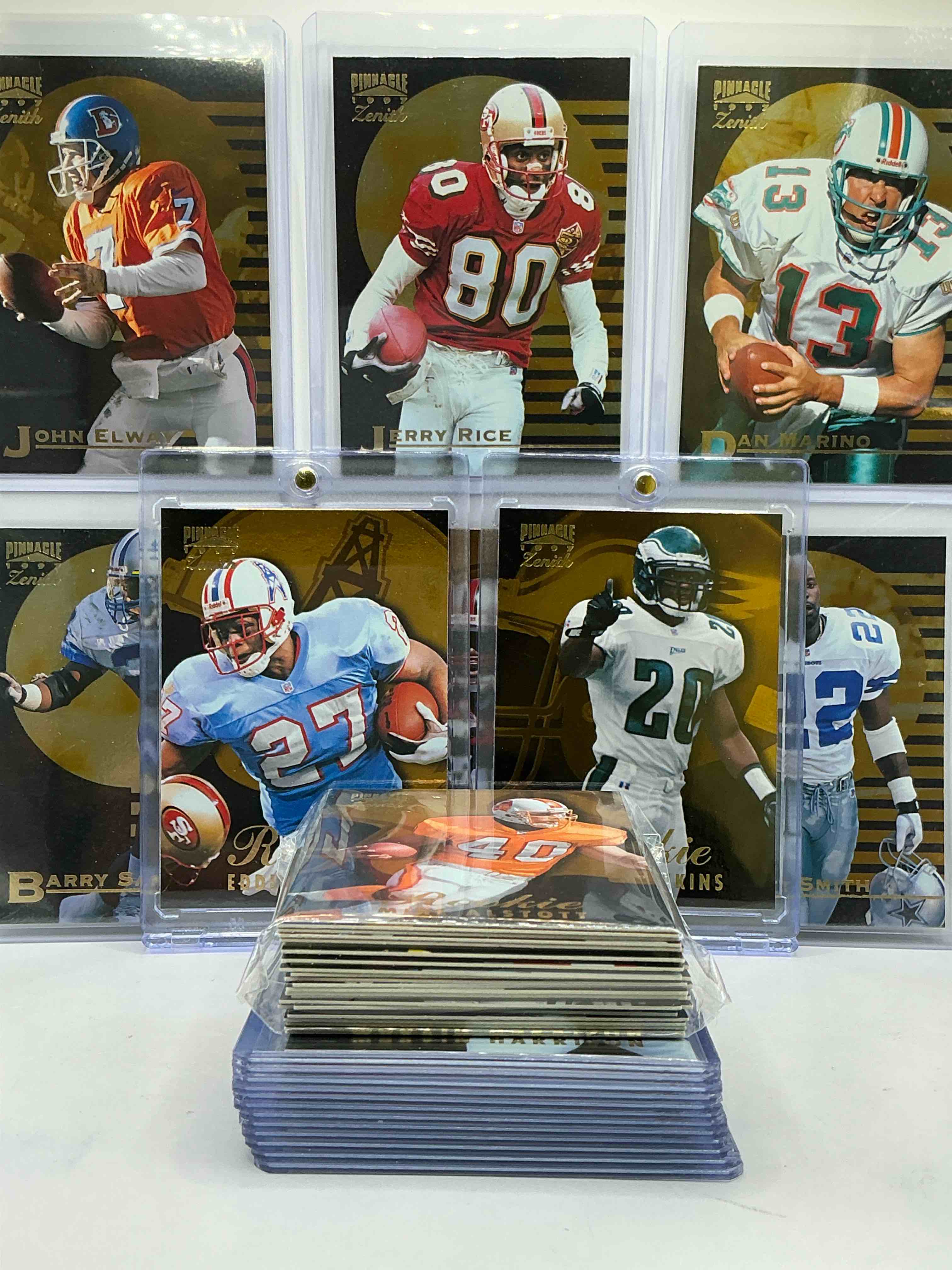 Condition photo showing New/Like New for 1997 pinnacle football cards! eddie george, brian dawkins, terrell owens & marvin harrison rookies! jerry rice, dan marino, emmitt smith & more! awesome, high quality cards! this 50 card lot includes commons, legends, rookies & more!