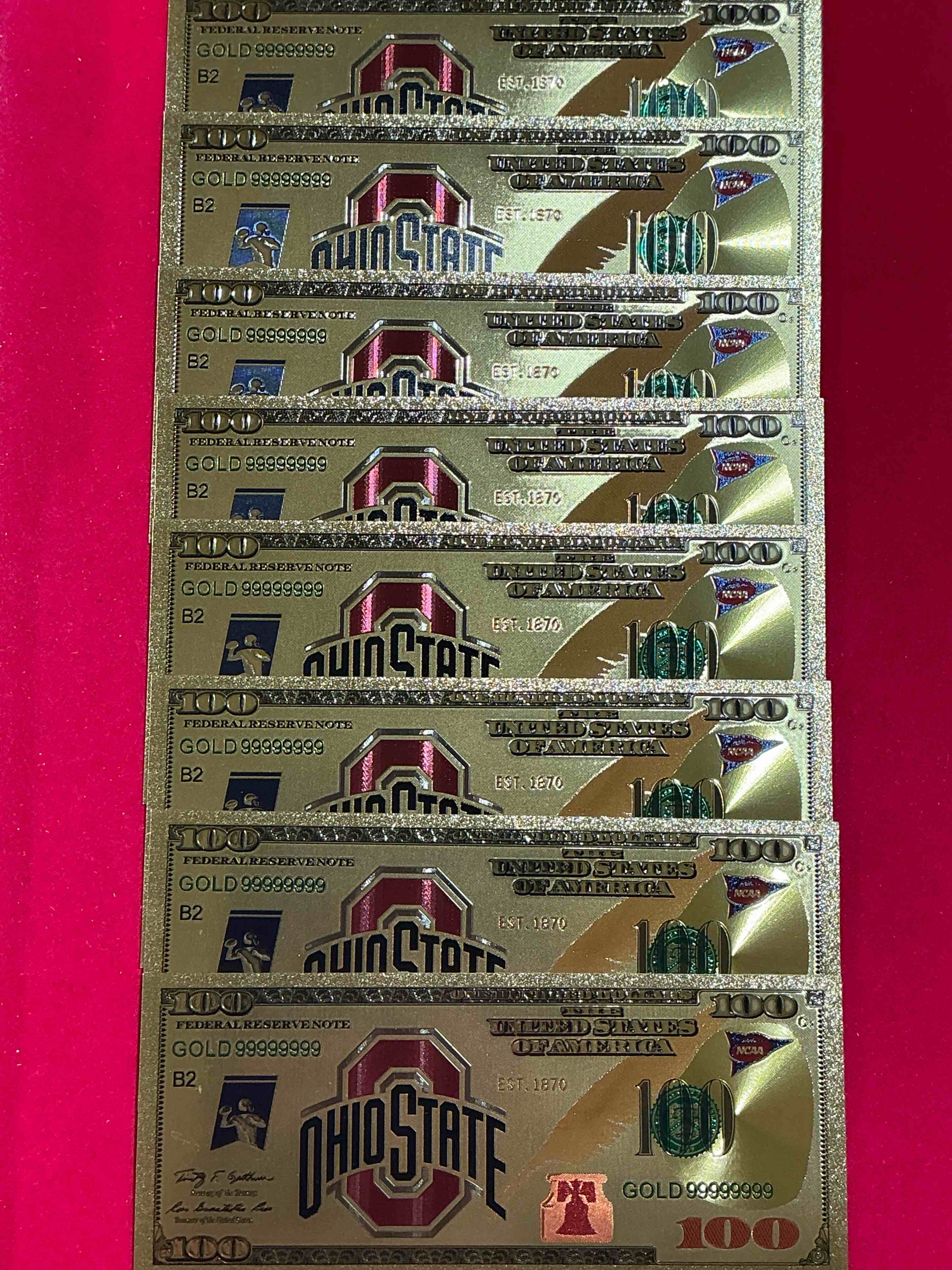 ohio state university collectible memorabilia! super cool, gold in color 100 dollar commemorative ohio state university bill! cool designs on front & back of bill! osu fans rejoice, cool memorabilia! plastic bills with cool designs! 
