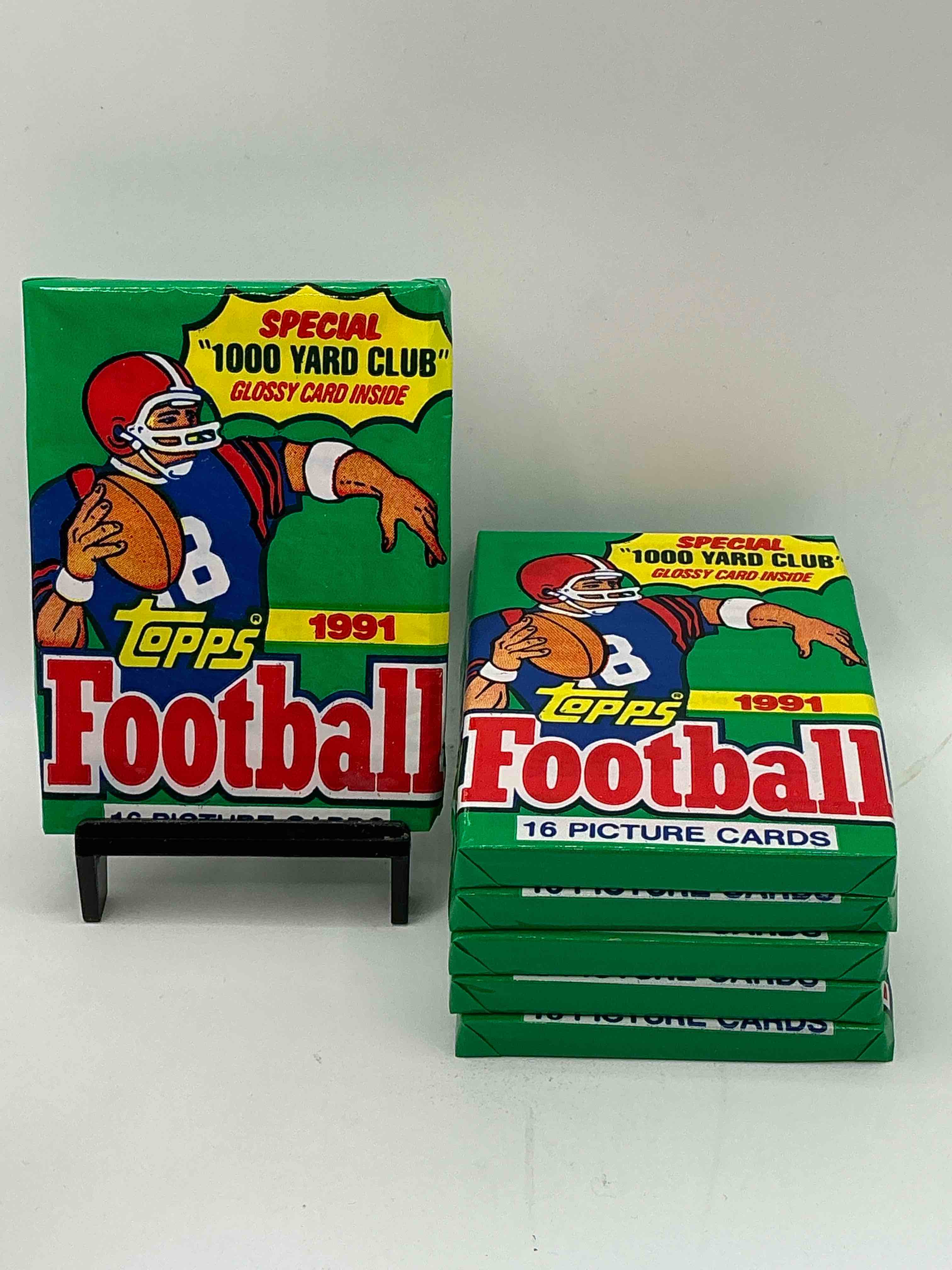 1991 topps football unopened sports card wax pack, direct from original retail case. search for early barry sanders, emmitt smith, jerry rice & joe montana!
