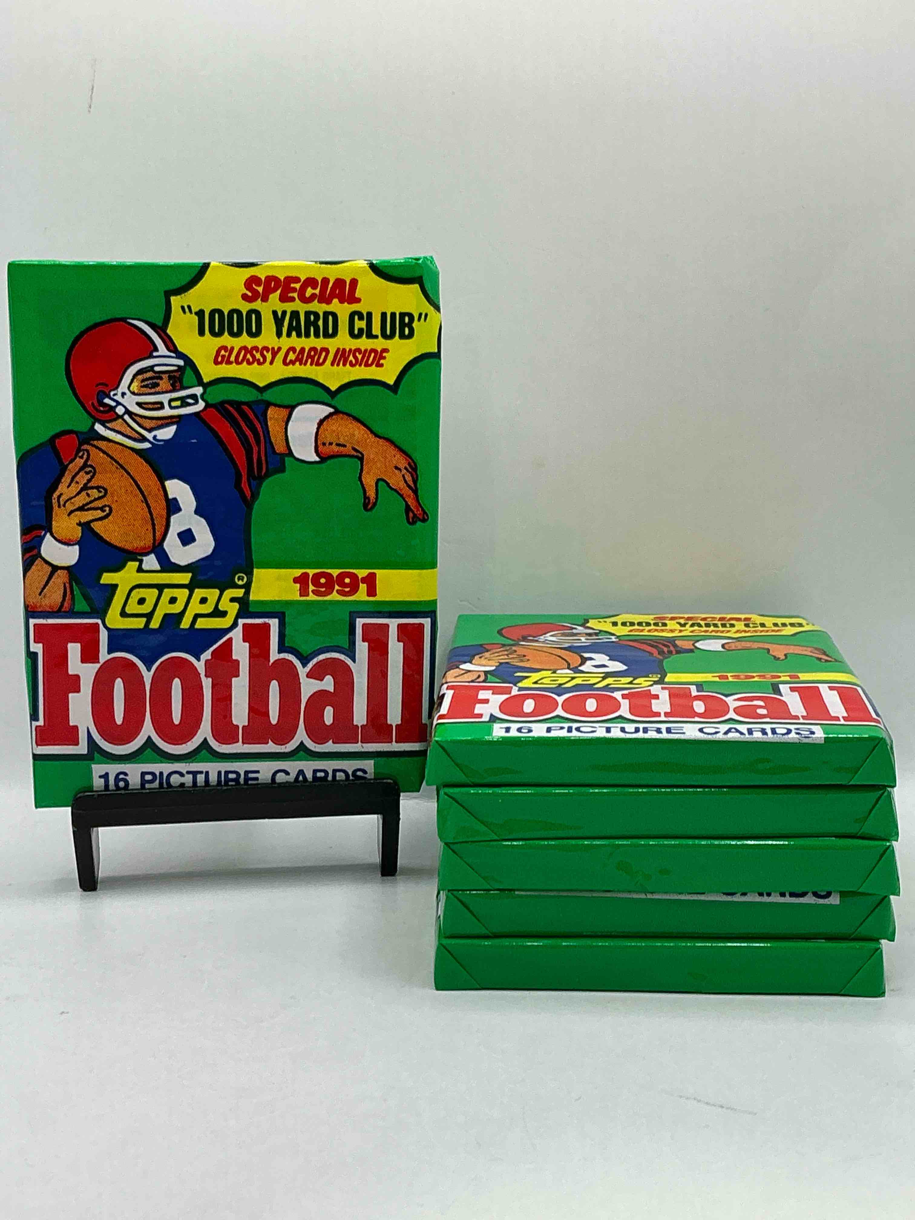 1991 topps football unopened sports card wax pack, direct from original retail case. search for early barry sanders, emmitt smith, jerry rice & joe montana!